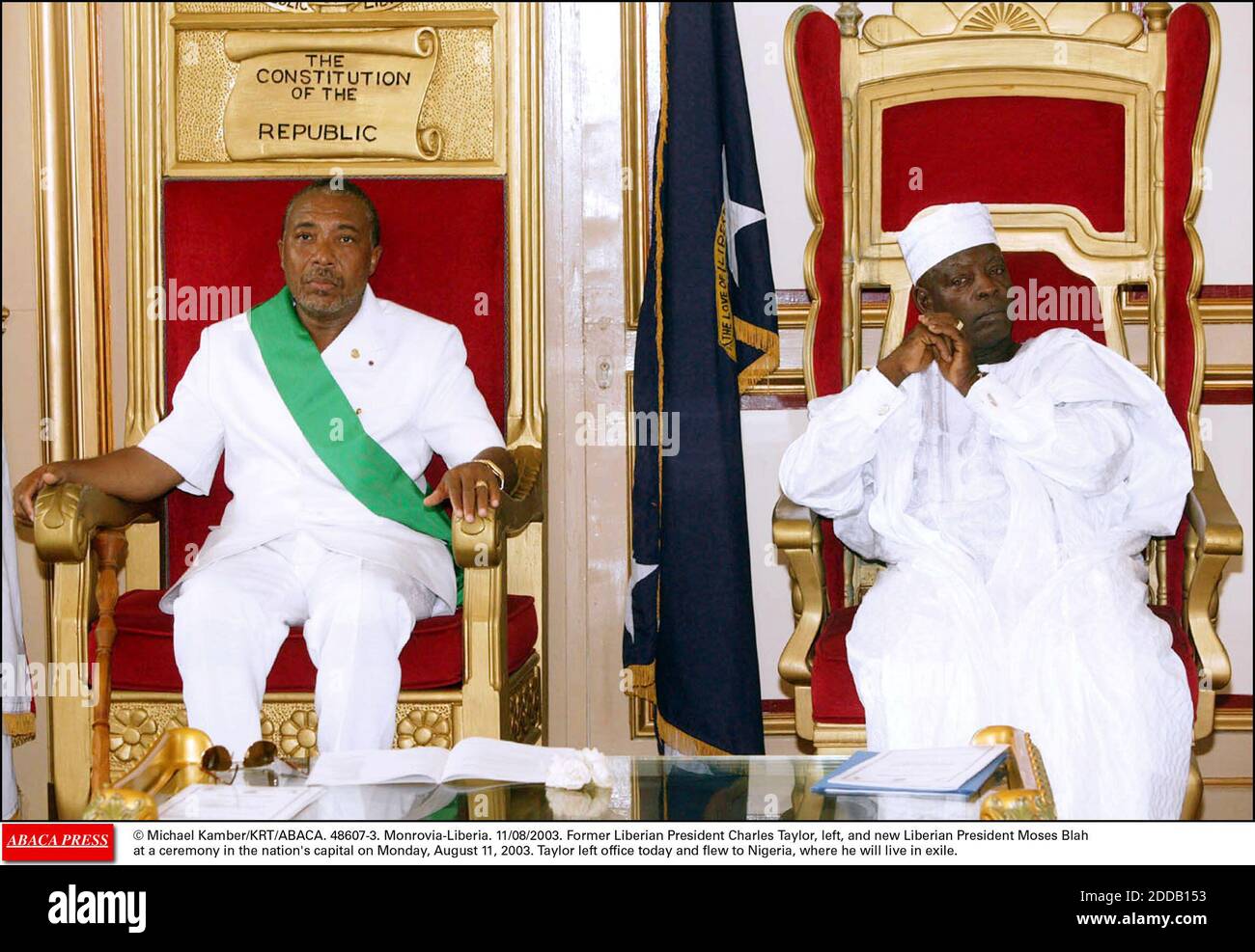 NO FILM, NO VIDEO, NO TV, NO DOCUMENTARY - © Michael Kamber/KRT/ABACA. 48607-3. Monrovia-Liberia. 11/08/2003. Former Liberian President Charles Taylor, left, and new Liberian President Moses Blah at a ceremony in the nation's capital on Monday, August 11, 2003. Taylor left office today and flew to Stock Photo