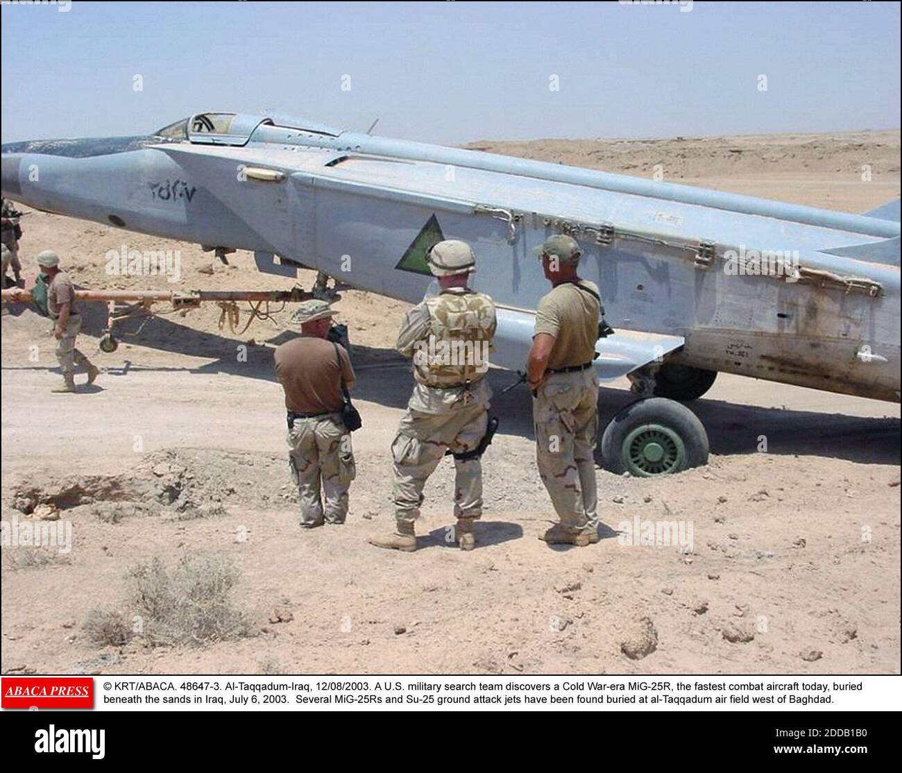 no-film-no-video-no-tv-no-documentary-krtabaca-48647-3-al-taqqadum-iraq-12082003-a-us-military-search-team-discovers-a-cold-war-era-mig-25r-the-fastest-combat-aircraft-today-buried-beneath-the-sands-in-iraq-july-6-2003-several-mig-25rs-and-su-25-ground-attack-jets-have-been-fo-2DDB1B0.jpg