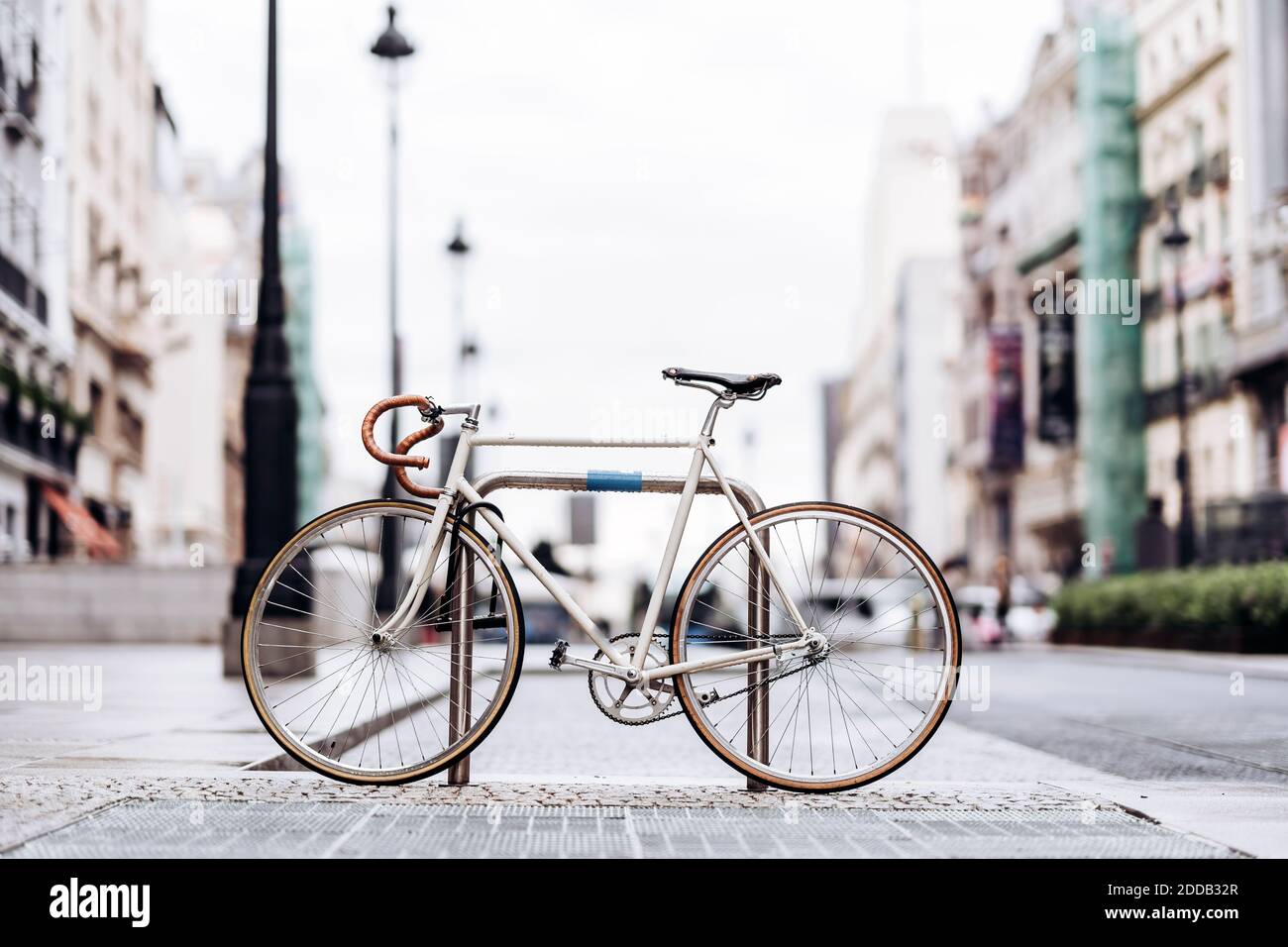 Racing bicycle locked to bicycle rack Stock Photo