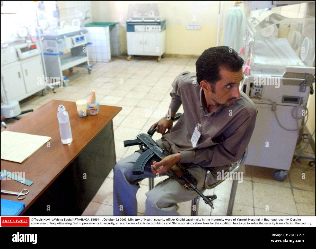 NO FILM, NO VIDEO, NO TV, NO DOCUMENTARY - © Travis Heying/Wicita Eagle/KRT/ABACA. 51594-1, October 22 2003. Ministry of Health security officer Khalid Jassim sits in the maternity ward of Yarmuk Hospital in Baghdad recently. Despite some area of Iraq witnessing fast improvements in security, a re Stock Photo