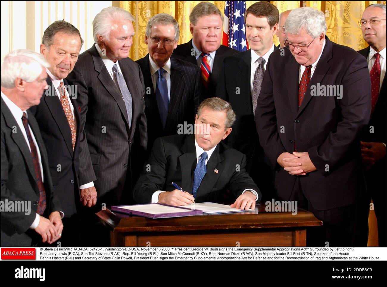 NO FILM, NO VIDEO, NO TV, NO DOCUMENTARY - © Steve Deslich/KRT/ABACA. 52425-1. Washington-DC-USA. November 6 2003. President George W. Bush signs the Emergency Supplemental Appropriations Act Surrounded by (left to right) Rep. Jerry Lewis (R-CA), Sen Ted Stevens (R-AK), Rep. Bill Young (R-FL), Sen Stock Photo