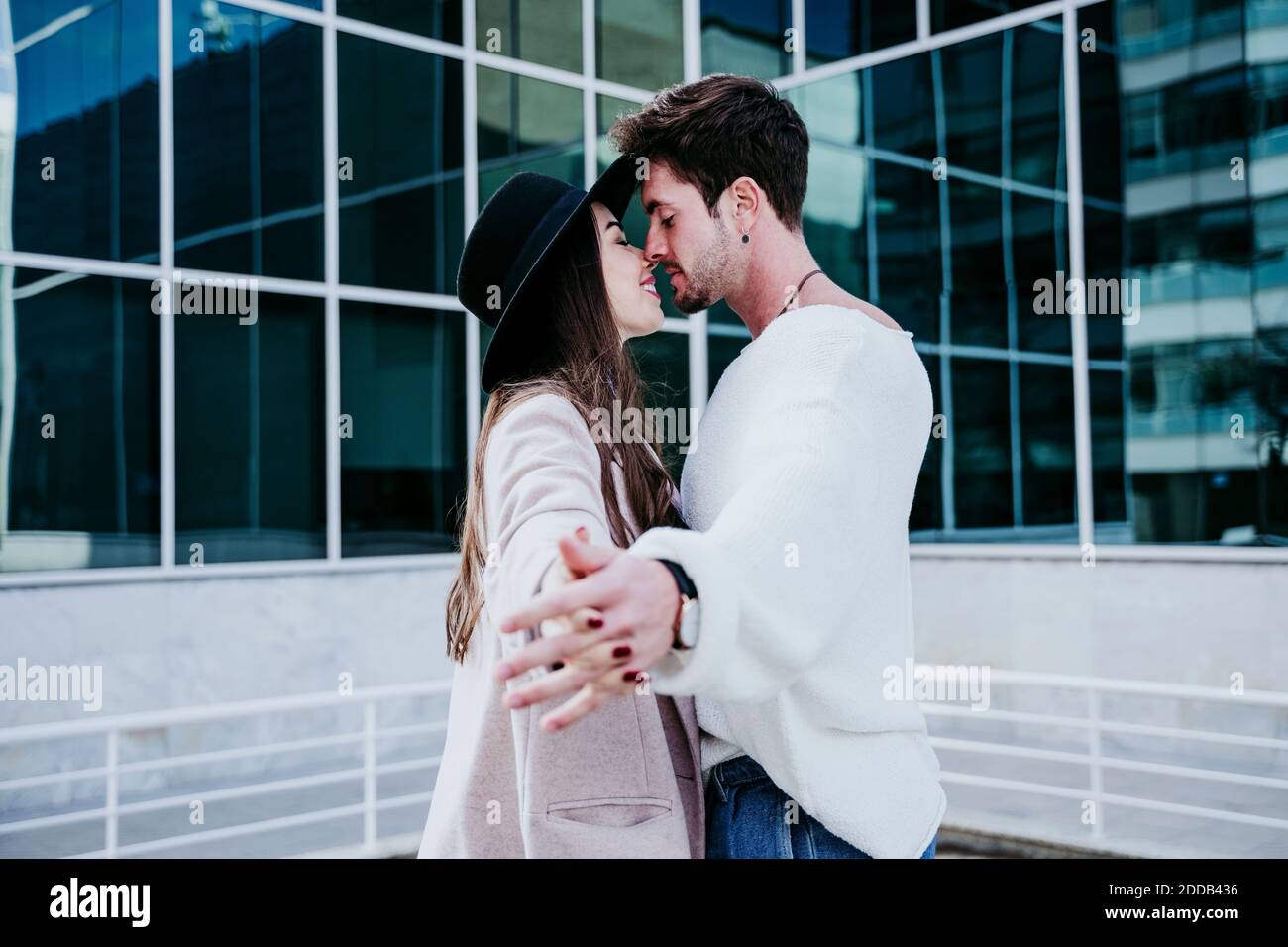 Woman kissing hands couple hi-res stock photography and images - Alamy