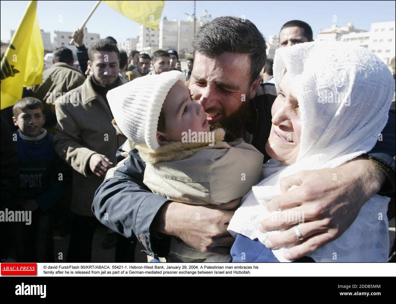 NO FILM, NO VIDEO, NO TV, NO DOCUMENTARY - © David Furst/Flash 90/KRT/ABACA. 55421-1. Hebron-West Bank, January 29, 2004. A Palestinian man embraces his family after he is released from jail as part of a German-mediated prisoner exchange between Israel and Hizbollah. Stock Photo