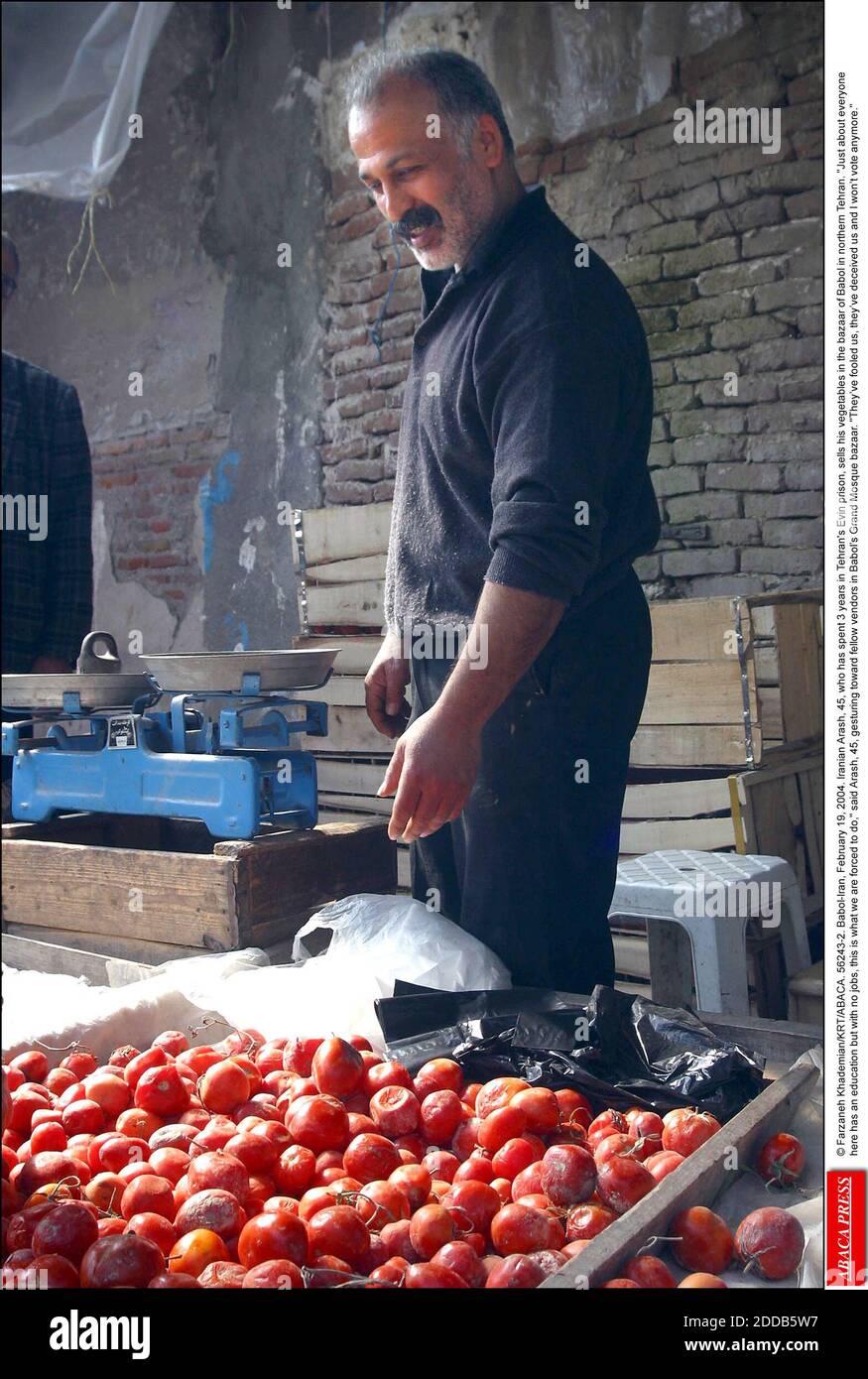 NO FILM, NO VIDEO, NO TV, NO DOCUMENTARY - © Farzaneh Khademian/KRT/ABACA. 56243-2. Babol-Iran, February 19, 2004. Iranian Arash, 45, who has spent 3 years in Tehran's Evin prison, sells his vegetables in the bazaar of Babol in northern Tehran. Just about everyone here has an education but with no jobs, this is what we are forced to do, said Arash, 45, gesturing toward fellow vendors in Babol's Grand Mosque bazaar. They've fooled us, they've deceived us and I won't vote anymore. Stock Photo