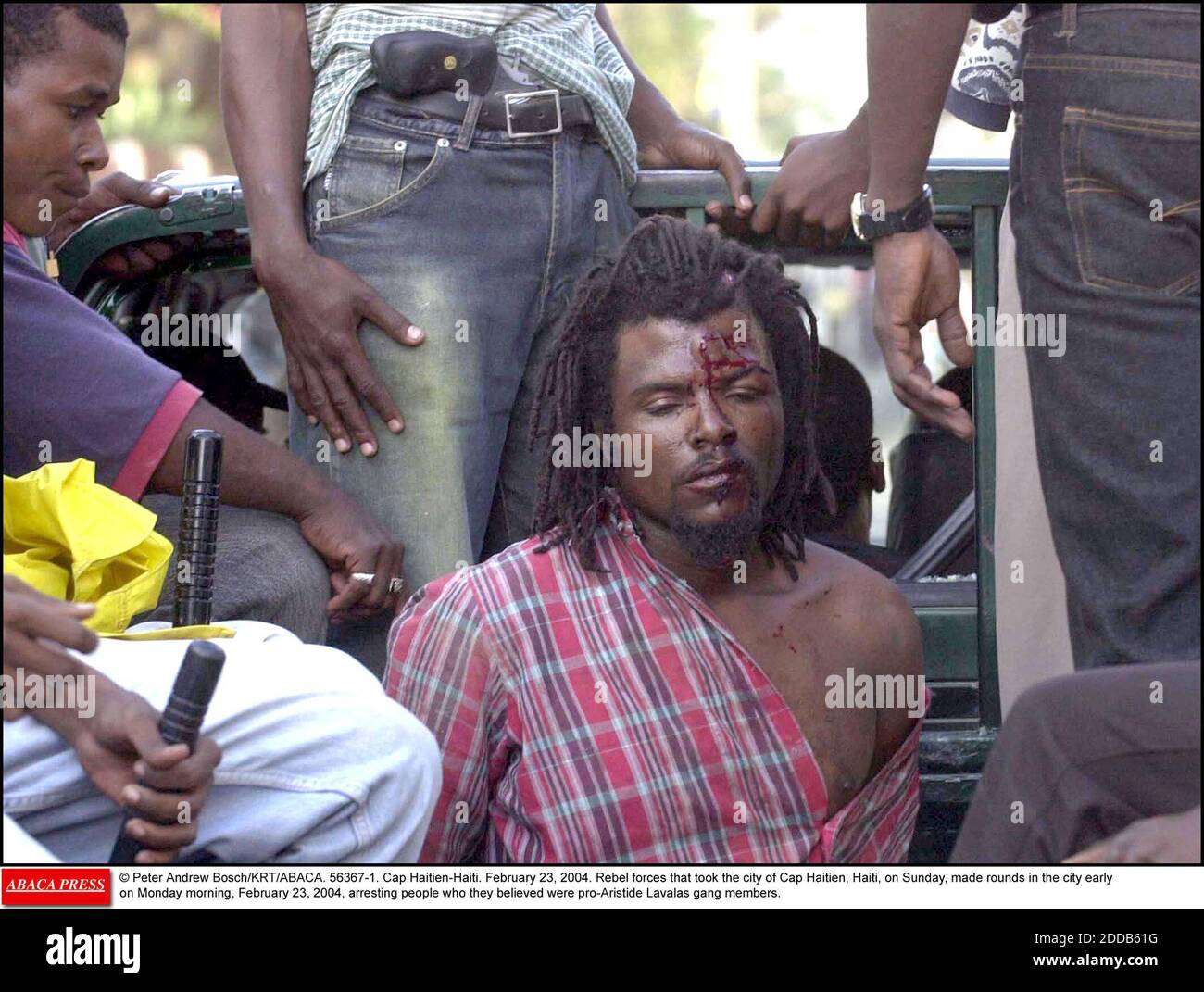 NO FILM, NO VIDEO, NO TV, NO DOCUMENTARY - © Peter Andrew Bosch/KRT/ABACA. 56367-1. Cap Haitien-Haiti. February 23, 2004. Rebel forces that took the city of Cap Haitien, Haiti, on Sunday, made rounds in the city early on Monday morning, February 23, 2004, arresting people who they believed were pr Stock Photo