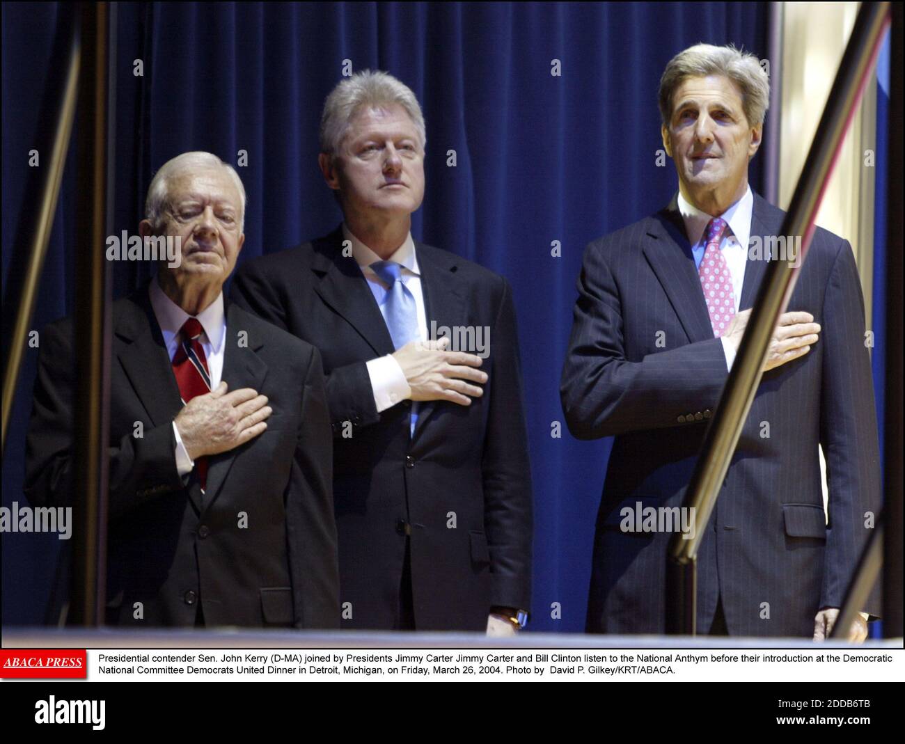 NO FILM, NO VIDEO, NO TV, NO DOCUMENTARY - Presidential contender Sen. John Kerry (D-MA) joined by Presidents Jimmy Carter Jimmy Carter and Bill Clinton listen to the National Anthym before their introduction at the Democratic National Committee Democrats United Dinner in Detroit, Michigan, on Friday, March 26, 2004. Photo by David P. Gilkey/KRT/ABACA. Stock Photo