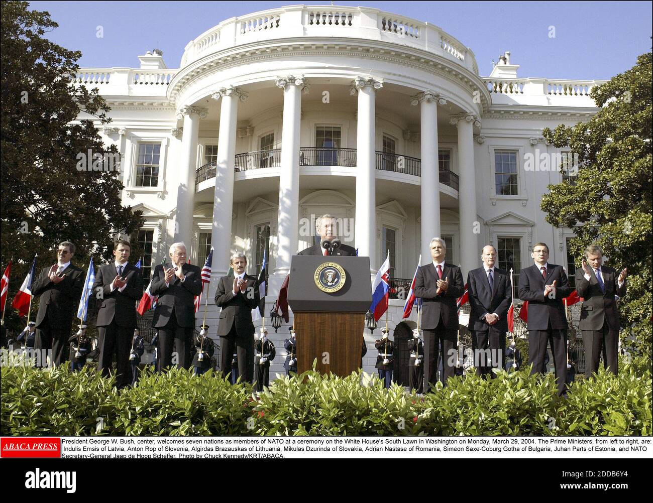 NO FILM, NO VIDEO, NO TV, NO DOCUMENTARY - President George W. Bush, center, welcomes seven nations as members of NATO at a ceremony on the White House's South Lawn in Washington on Monday, March 29, 2004. The Prime Ministers, from left to right, are: Indulis Emsis of Latvia, Anton Rop of Slovenia, Algirdas Brazauskas of Lithuania, Mikulas Dzurinda of Slovakia, Adrian Nastase of Romania, Simeon Saxe-Coburg Gotha of Bulgaria, Juhan Parts of Estonia, and NATO Secretary-General Jaap de Hoop Scheffer. Photo by Chuck Kennedy/KRT/ABACA. Stock Photo