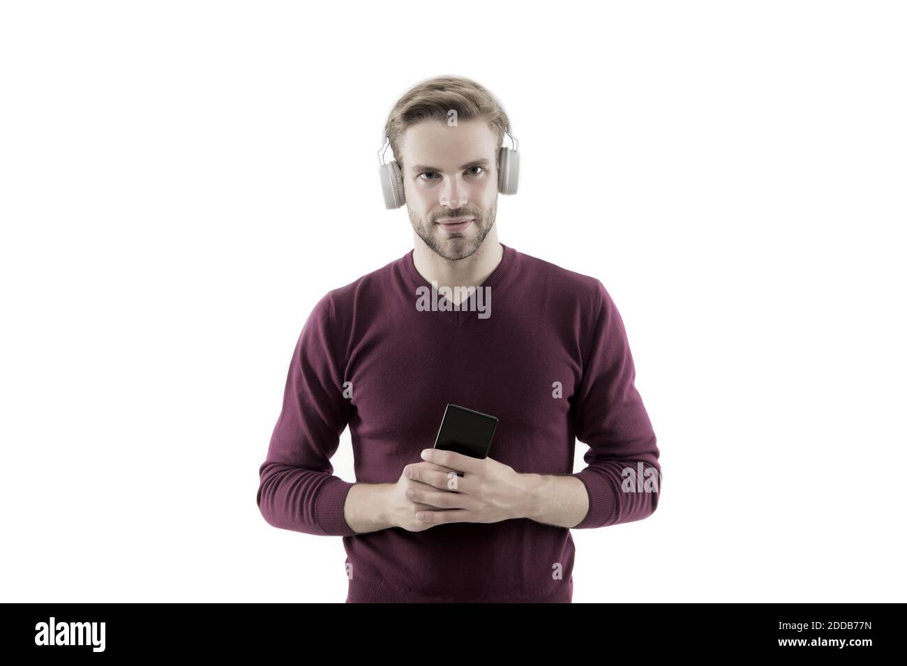 change musical track on mobile phone. confident guy open playlist on mp3  player. charismatic music lover. handsome unshaven man isolated on white.  man listen music in earphones Stock Photo - Alamy