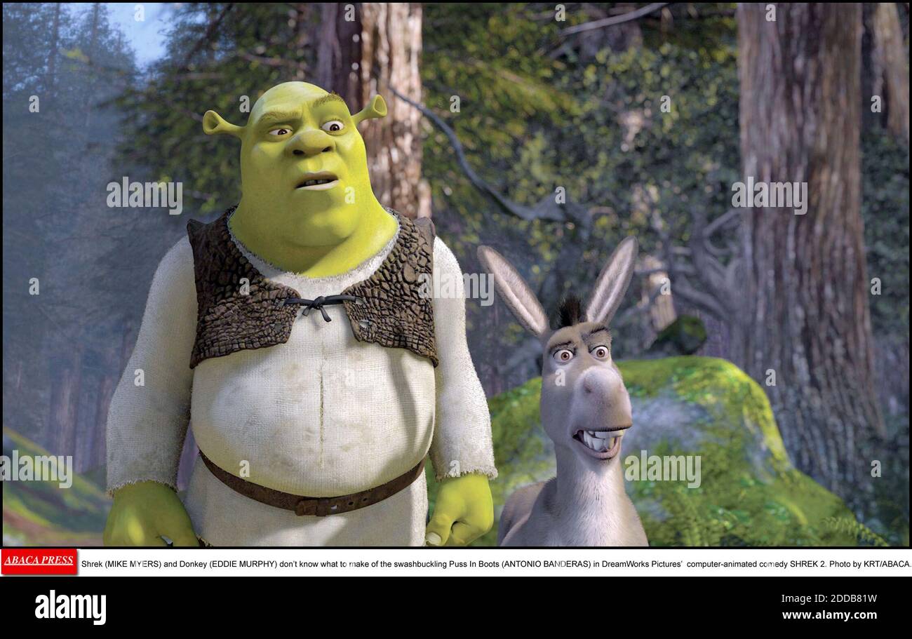 NO FILM, NO VIDEO, NO TV, NO DOCUMENTARY - Shrek (MIKE MYERS) and Donkey (EDDIE MURPHY) don't know what to make of the swashbuckling Puss In Boots (ANTONIO BANDERAS) in DreamWorks Pictures' computer-animated comedy SHREK 2. Photo by KRT/ABACA. Stock Photo