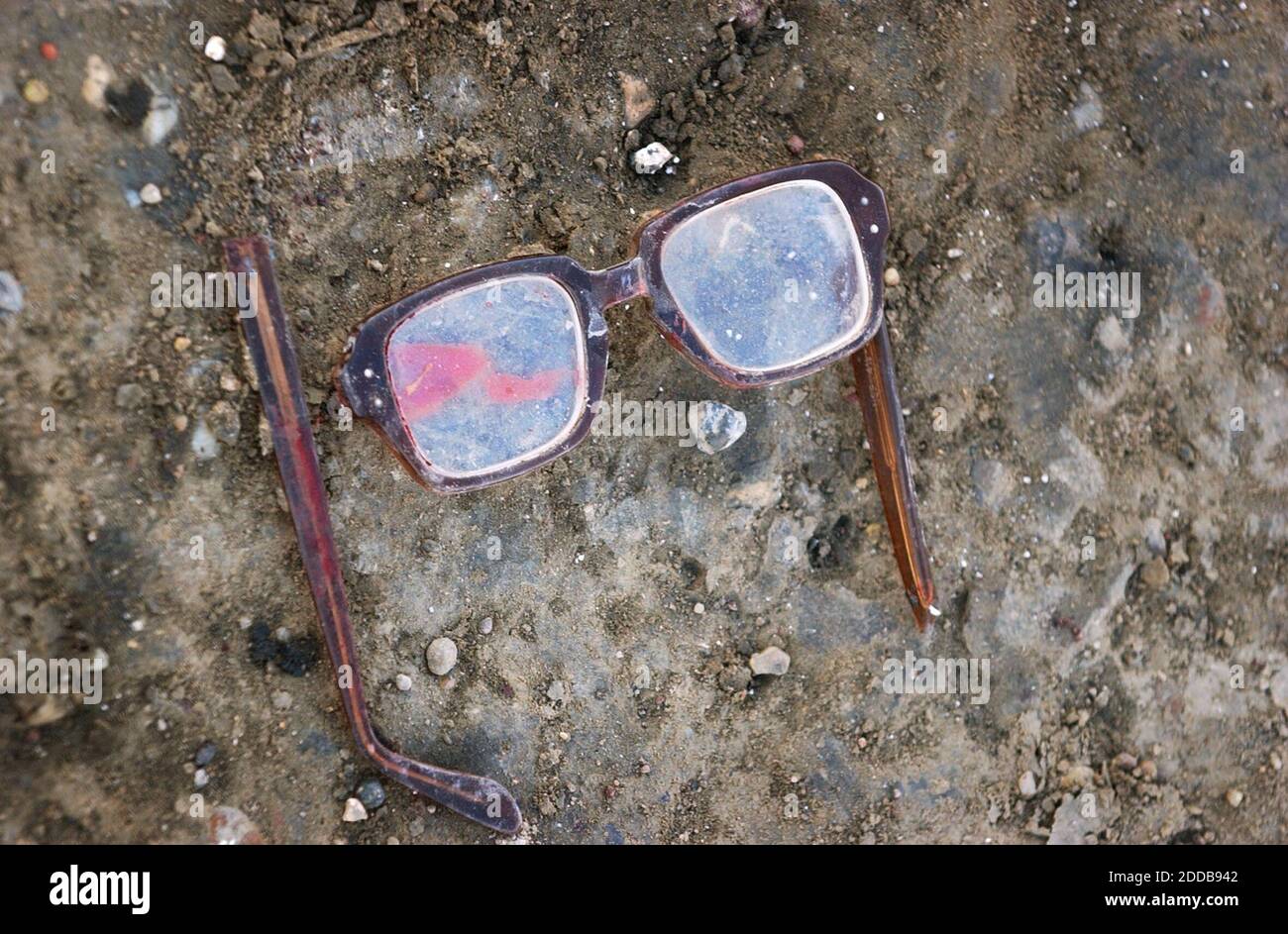 NO FILM, NO VIDEO, NO TV, NO DOCUMENTARY - The blood-stained glasses of a U.S. Marine Pfc. Ryan Jerabek lie in the street after a firefight in Ramadi, Iraq, on April 6, 2004. Photo by David Swanson/Philadelphia Inquirer/KRT/ABACA. Stock Photo