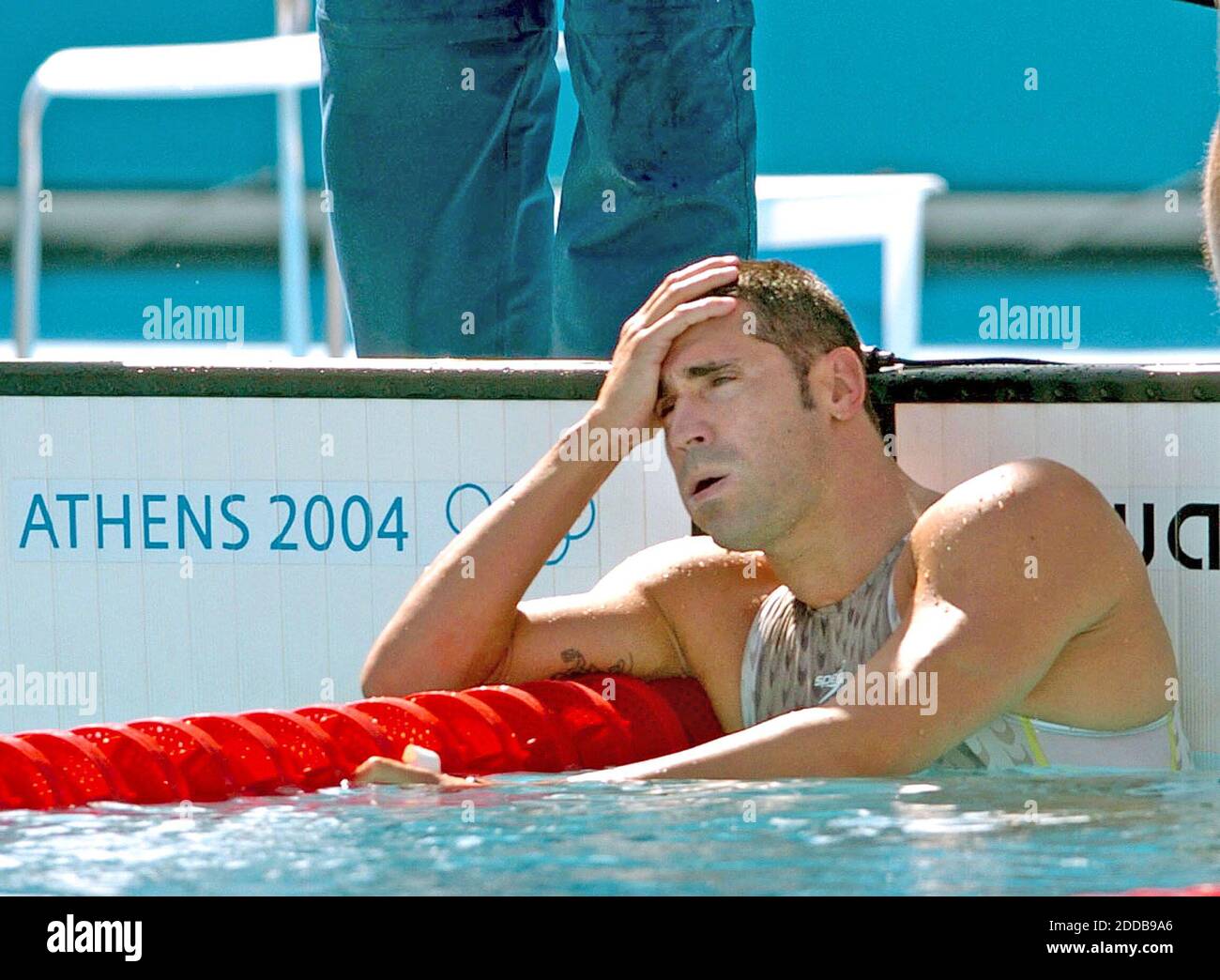 NO FILM, NO VIDEO, NO TV, NO DOCUMENTARY - Franck Esposito of France reacts after tying for second in his 200-meter butterfly qualifying heat on Monday, August 16, 2004, during the Olympic Games in Athens, Greece. Photo by Karl Mondon/KRT/ABACA. Stock Photo