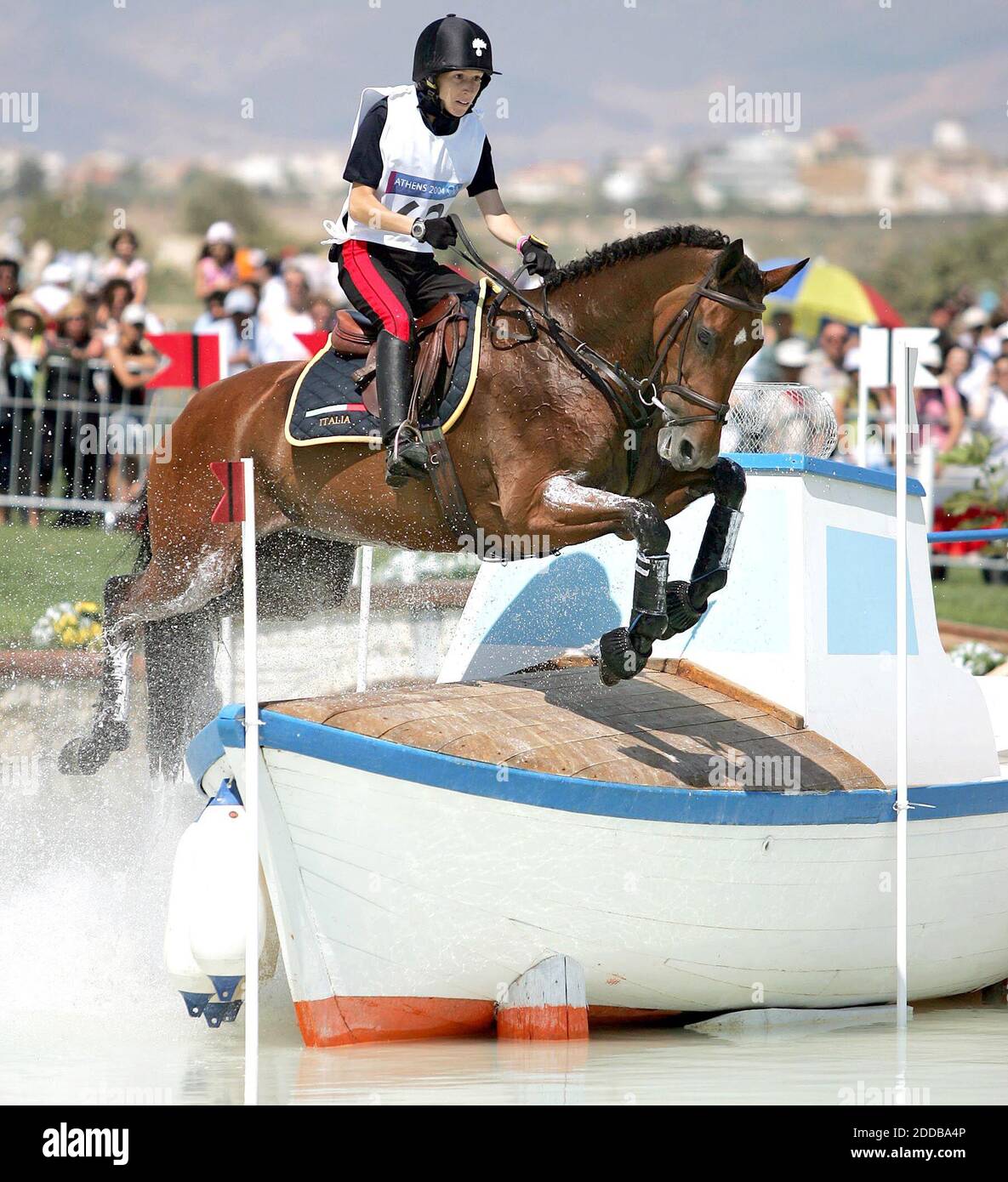 NO FILM, NO VIDEO, NO TV, NO DOCUMENTARY - Susanna Bordone of Italy navigates the cross country course of team eventing on Tuesday, August 17, 2004, in the 2004 Olympic Games in Markopoulo. Photo by Al DIaz/Miami Herald/KRT/ABACA. Stock Photo