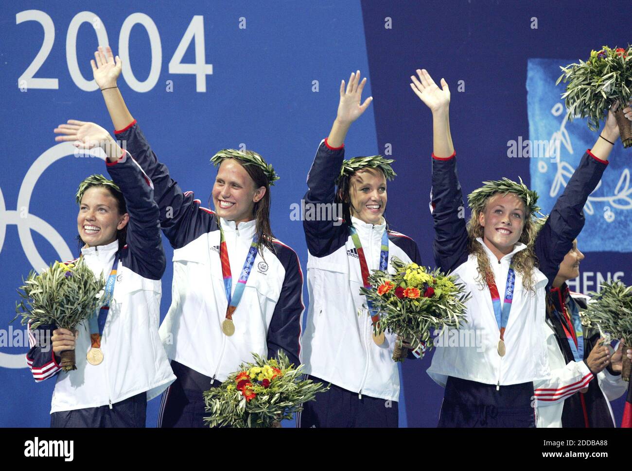 NO FILM, NO VIDEO, NO TV, NO DOCUMENTARY - Members of the U.S. 4x200 freestyle relay team, from left, Natalie Coughlin, Carly Piper, Dana Vollmer and Kaitlin Sandeno, celebrate winning gold at the 2004 Olympic Games on Wednesday, August 18, 2004. Photo by David Eulitt/Kansas City Star/KRT/ABACA. Stock Photo