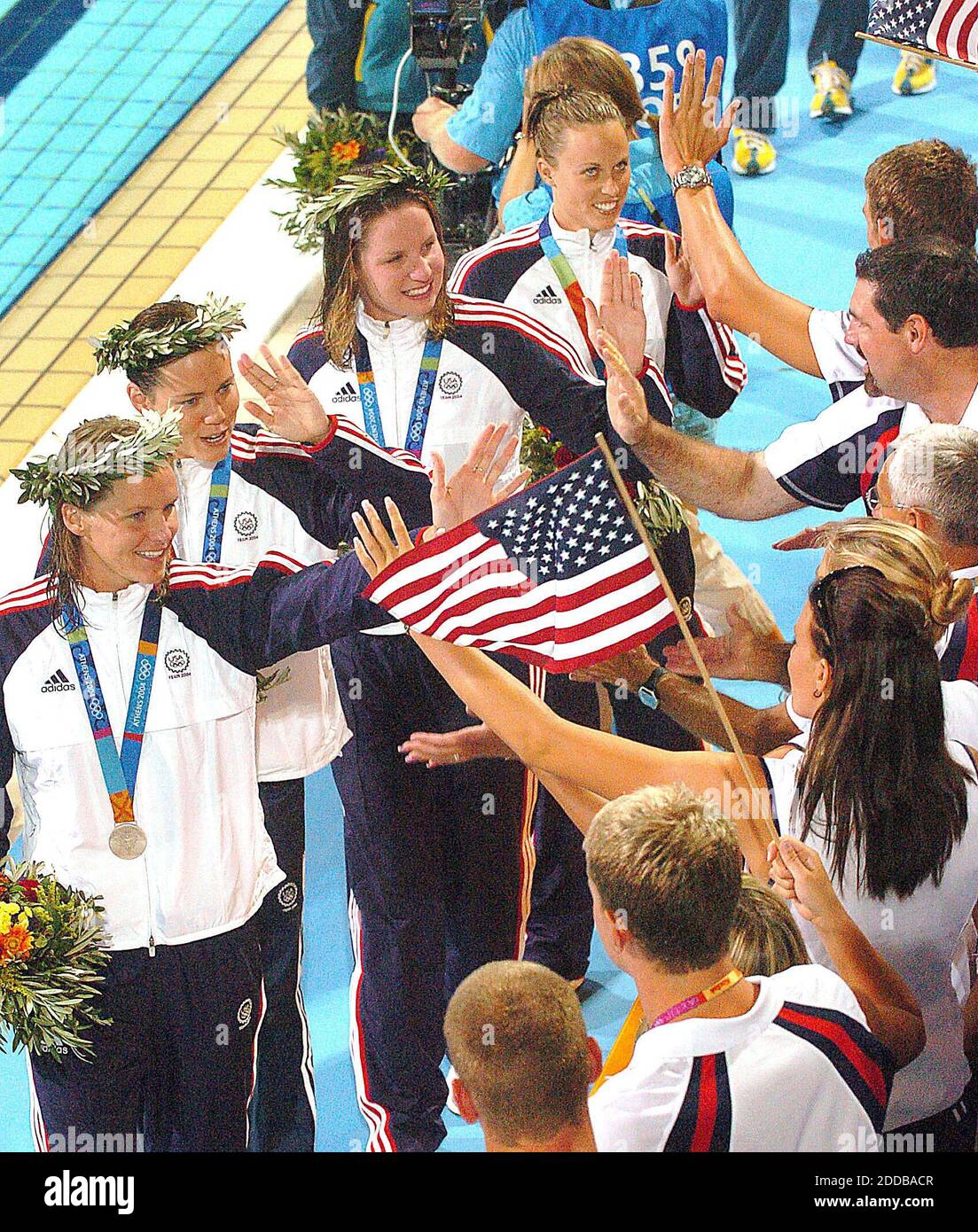 NO FILM, NO VIDEO, NO TV, NO DOCUMENTARY - Members of the U.S. women's 4x100 medley relay team celebrate winning the silver medal in the 2004 Olympic Games on Saturday, August 21, 2004, in Athens-Greece. Photo by Patrick Schneider/KRT/ABACA. Stock Photo