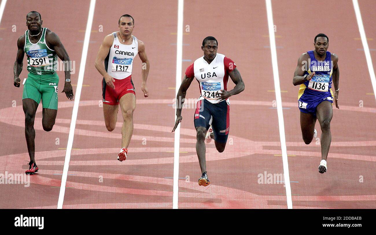 NO FILM, NO VIDEO, NO TV, NO DOCUMENTARY - Shawn Crawford of the United States, second from right, leads the field in a heat of the 100 meters at the 2004 Olympic Games on Saturday, August 21, 2004.Photo by Nhat V. Meyer/San Jose Mercury News/KRT/ABACA Stock Photo