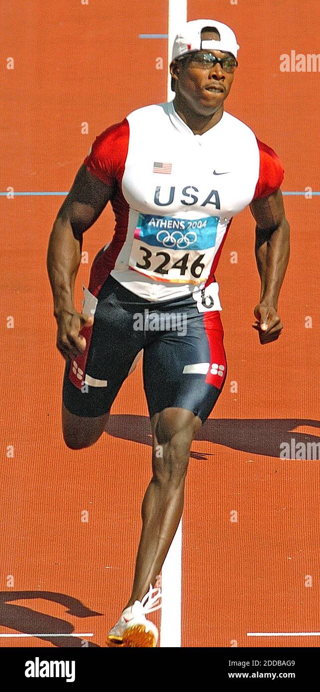 NO FILM, NO VIDEO, NO TV, NO DOCUMENTARY - Shawn Crawford of the United  States competes in a 100 meter heat on Saturday, August 21, 2004, during  the 2004 Olympic Games in