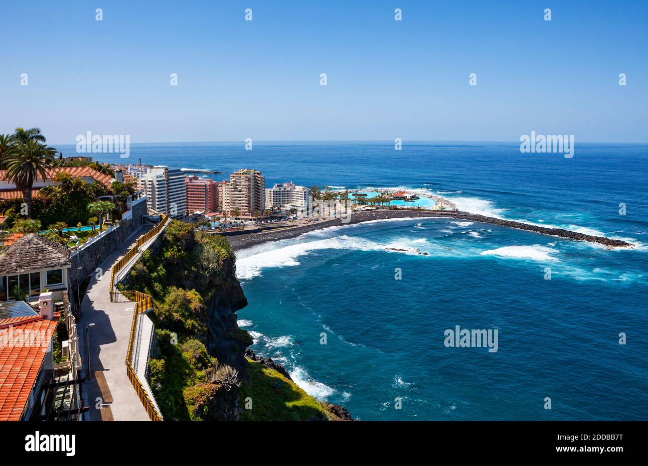 Spain, Province of Santa Cruz de Tenerife, Puerto de la Cruz, Coastal city  in summer with clear line of horizon in background Stock Photo - Alamy