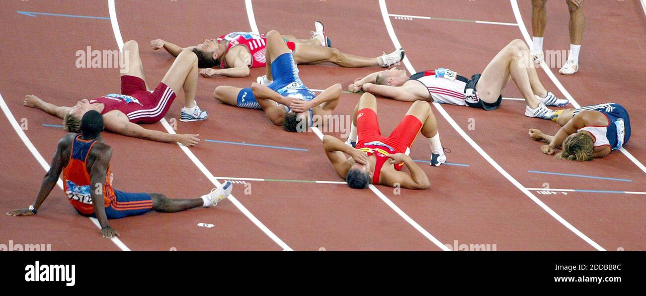 NO FILM, NO VIDEO, NO TV, NO DOCUMENTARY - Decathlon athletes lay on the  track after completing the 1500 meter run, the final event of a ten sport  competition, at Olympic Stadium
