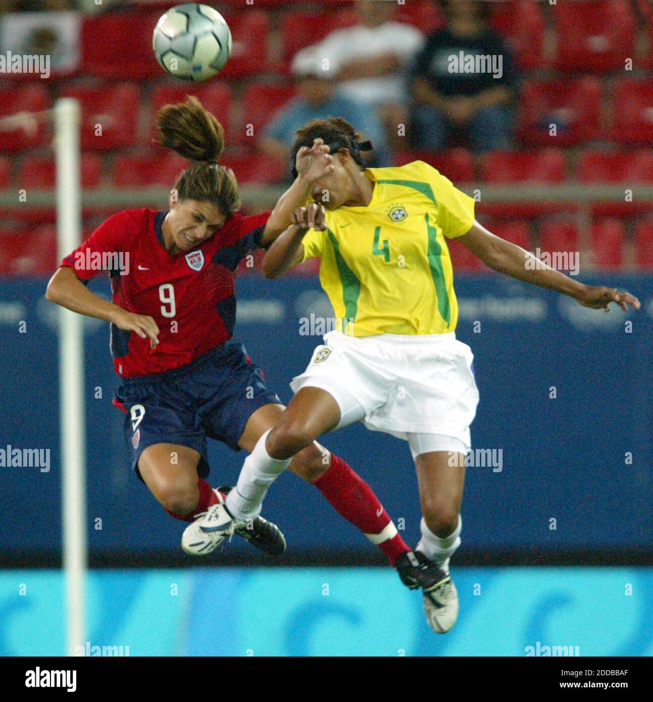 NO FILM, NO VIDEO, NO TV, NO DOCUMENTARY - Mia Hamm of the United States, left, and Brazil's Tania fight for a header in the first half of the gold medal soccer game in Athens August 26, 2004. The United States won the game 2-1 in double overtime. Photo by Mark Reis/Colorado Springs Gazette/KRT/AB Stock Photo
