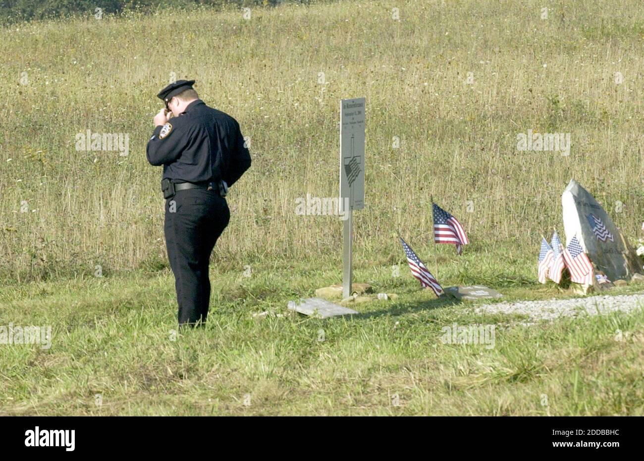 NO FILM, NO VIDEO, NO TV, NO DOCUMENTARY - Retired New York City police officer Rob O'Donnell, who was injured in the World Trade Center attack, looks over a memorial before ceremonies Saturday, September 11, 2004, in Shanksville, Pennsylvania, honoring those killed when Flight 93 crashed after being hijacked by terrorists in 2001. Photo by Laurence Kesterson/Philadelphia Inquirer/KRT/ABACA. Stock Photo