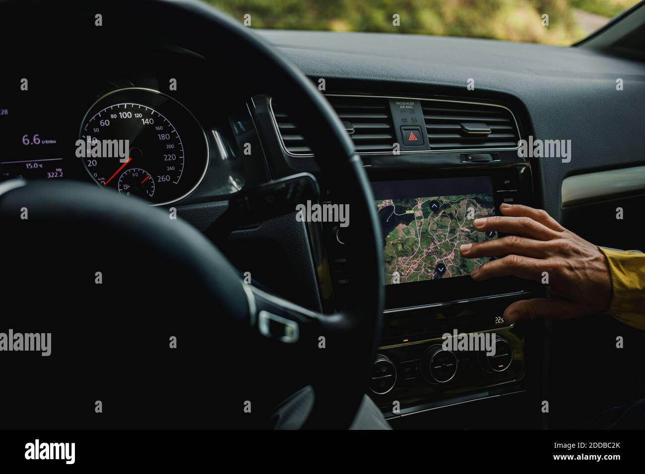Hand of woman checking digital maps in car during vacations Stock Photo