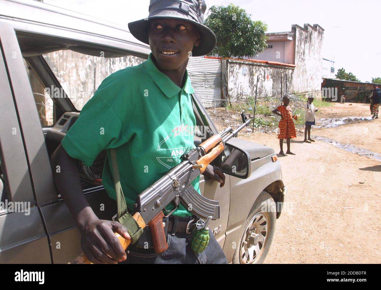 NO FILM, NO VIDEO, NO TV, NO DOCUMENTARY - A young soldier holds his automatic weapon in the town of Bunia, Democratic Republic of Congo, Friday, May 30, 2003. Child soldiers have long been fixtures in Africa's lingering civil conflicts. Photo by Evelyn Hockstein/KRT/ABACA. Stock Photo