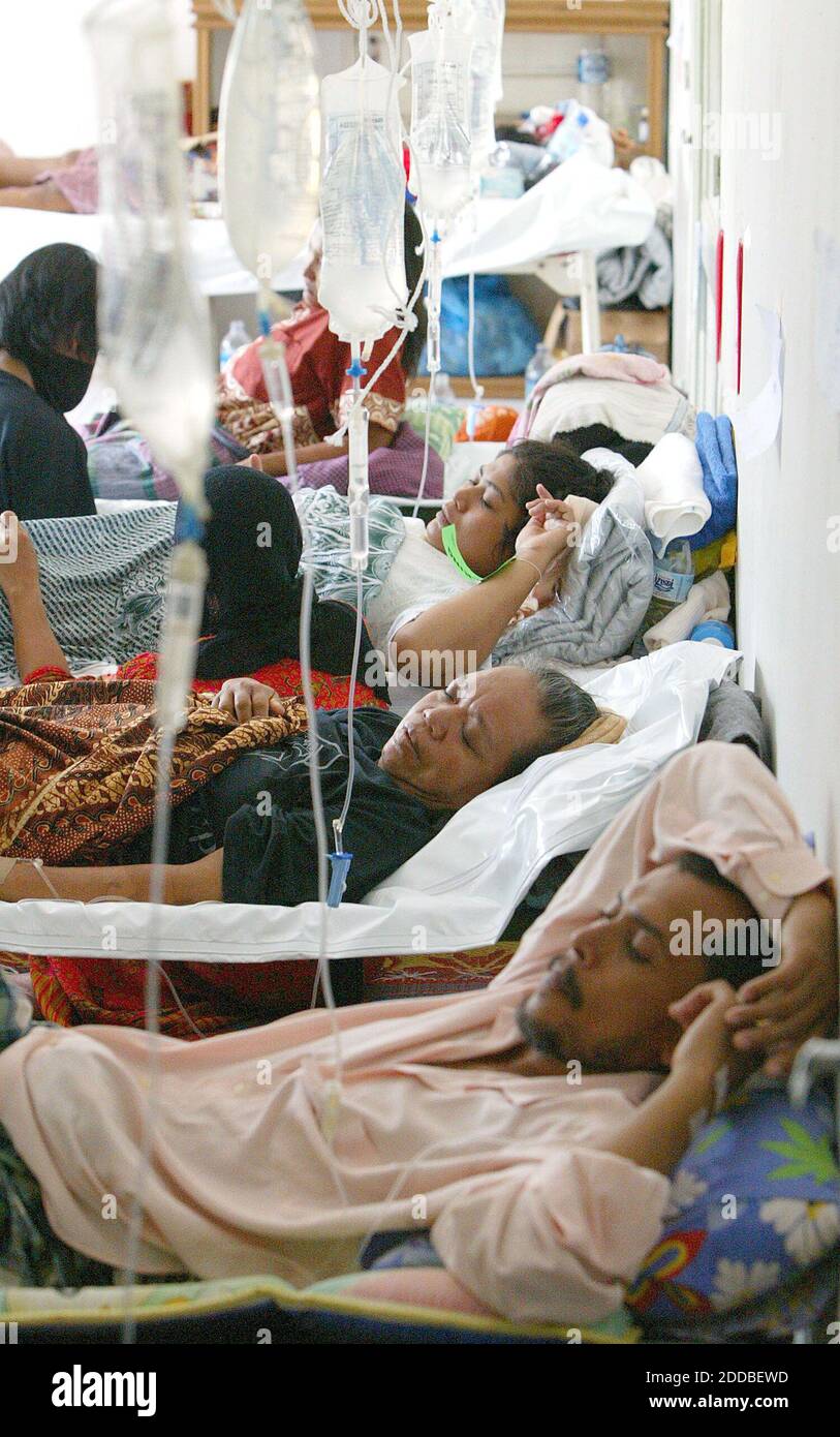 NO FILM, NO VIDEO, NO TV, NO DOCUMENTARY - Patients lie in a crowded ward  at the Fakinah Hospital in Banda Aceh, Indonesia, Wednesday January 12,  2005. The Fakinah Hospital is the