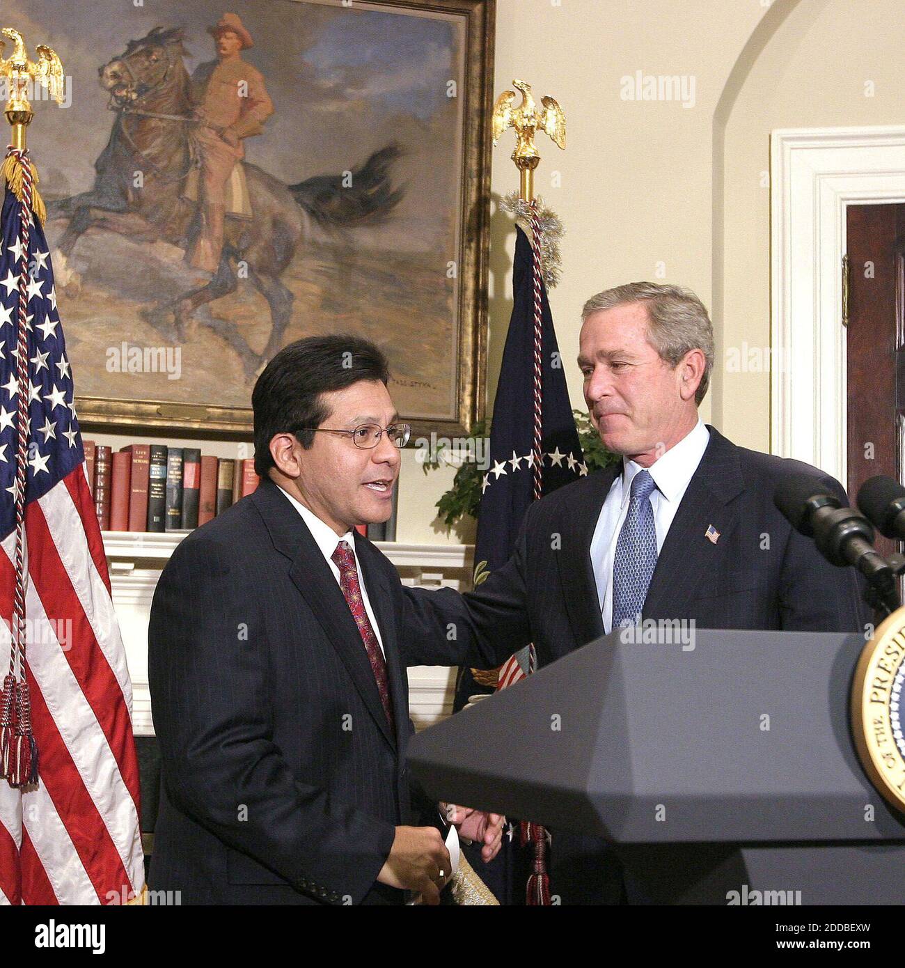 NO FILM, NO VIDEO, NO TV, NO DOCUMENTARY - White Counsel Alberto Gonzales, left, joins President George W. Bush, right, in a statement to the media after being nominated to fill the spot of U.S. Attorney General to replace John Ashcroft. Photo by Chuck Kennedy/KRT/ABACA. Stock Photo