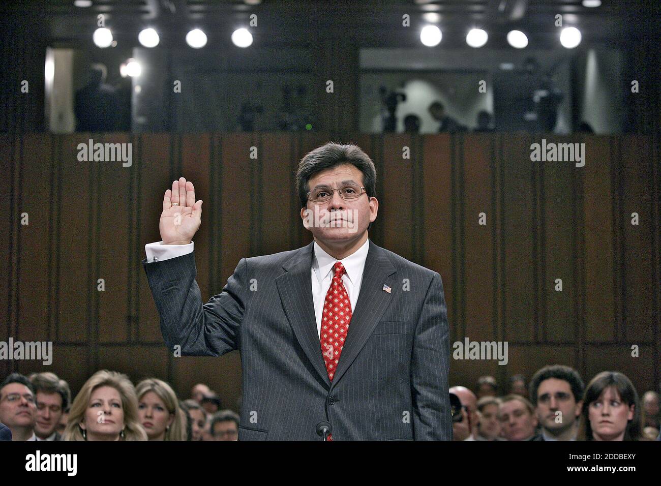 NO FILM, NO VIDEO, NO TV, NO DOCUMENTARY - Attorney General nominee Alberto Gonzales is sworn-in before the Senate Judiciary Committee to testify on his confirmation. January, 6, 2005 on Capitol Hill in Washington, DC. White House counsel Gonzales, in line to become the first Hispanic attorney general, had a hand in much of the White House's post-Sept. 11 terrorism policies as President Bush's top lawyer. (Pictured: Alberto Gonzales) Photo by Chuck Kennedy/KRT/ABACA Stock Photo