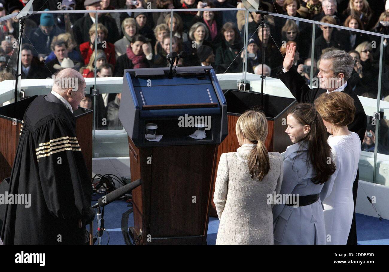 NO FILM, NO VIDEO, NO TV, NO DOCUMENTARY - President George W. Bush, far right, takes the oath of office from Chief Justice William Rehnquist, left, as daughters Barbara, center, and Jenna, third from right, and First Lady Laura Bush look on. Washington, DC, USA, on January 20, 2005. Photo by Chuck Kennedy/US News Story Slugged/KRT/ABACA. Stock Photo