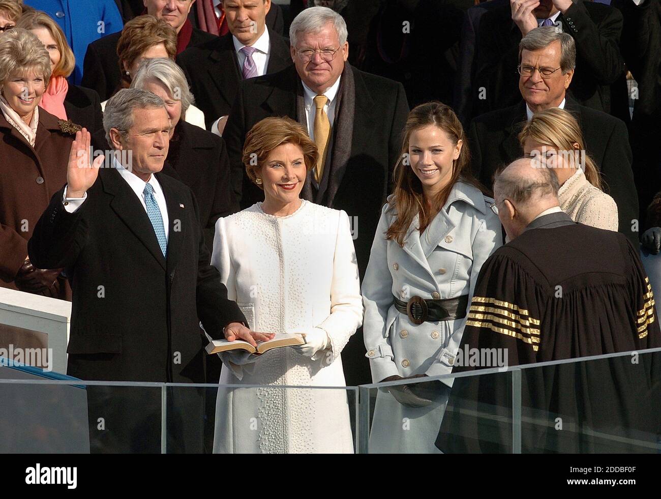 NO FILM, NO VIDEO, NO TV, NO DOCUMENTARY - U.S. President George W. Bush takes the Oath of Office from Supreme Court Justice William Rehnquist during Inauguration ceremonies on Capitol Hill in Washington, January 20, 2005, as First Lady Laura Bush, center, looks on with daughters Barbara, second from right and Jenna, right. Washington, DC, USA, on January 20, 2005. Photo by George Bridges/US News Story Slugged/KRT/ABACA. Stock Photo