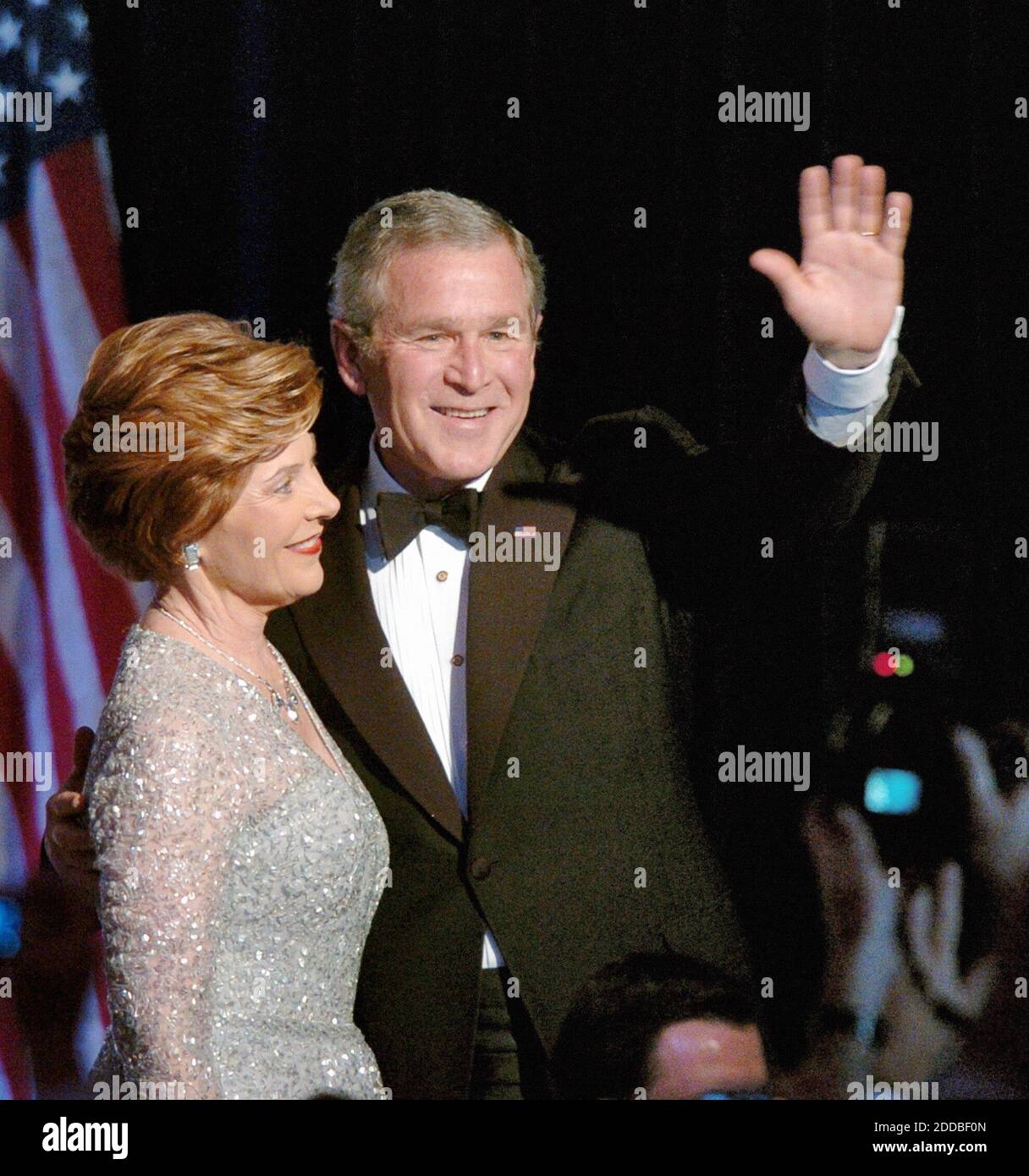 NO FILM, NO VIDEO, NO TV, NO DOCUMENTARY - President George W. Bush and first lady Laura Bush wave as they depart the Constitution Ball that is part of the inauguration festivities in Washington, DC, USA, on January 20, 2005. Photo by Georges Bridges/US News Story Slugged/KRT/ABACA. Stock Photo