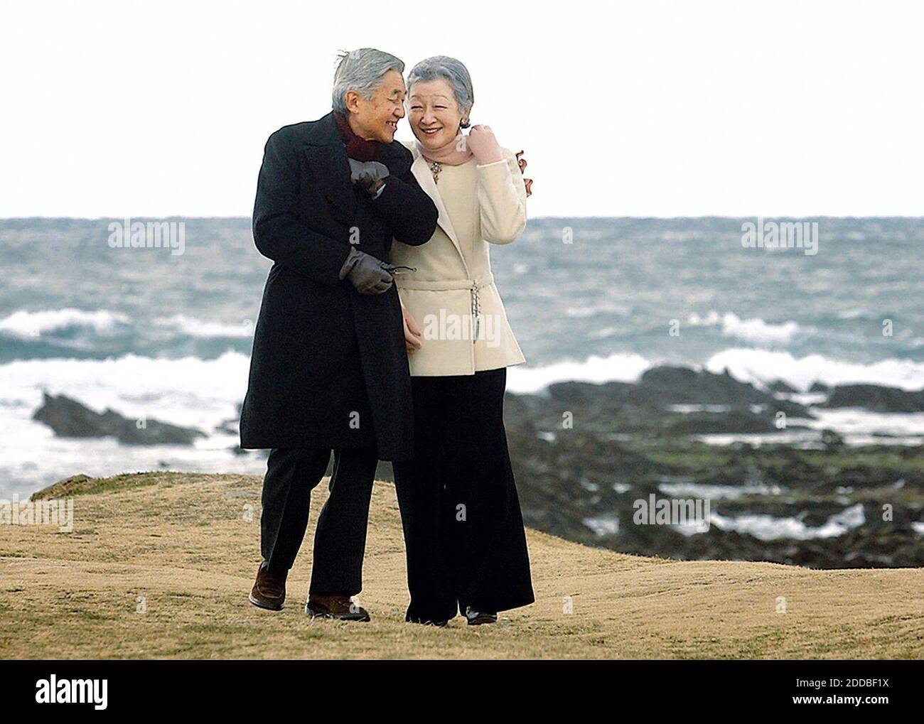 NO FILM, NO VIDEO, NO TV, NO DOCUMENTARY - The Emperor Akihito of Japan and Empress Michiko walk along the seashore in Hayamamachi, Kanagawa Prefecture, Wednesday, January 3, 2005, after arriving at a nearby Imperial villa earlier in the morning. Photo by Yomiuri Shimbun/KRT/ABACA. Stock Photo
