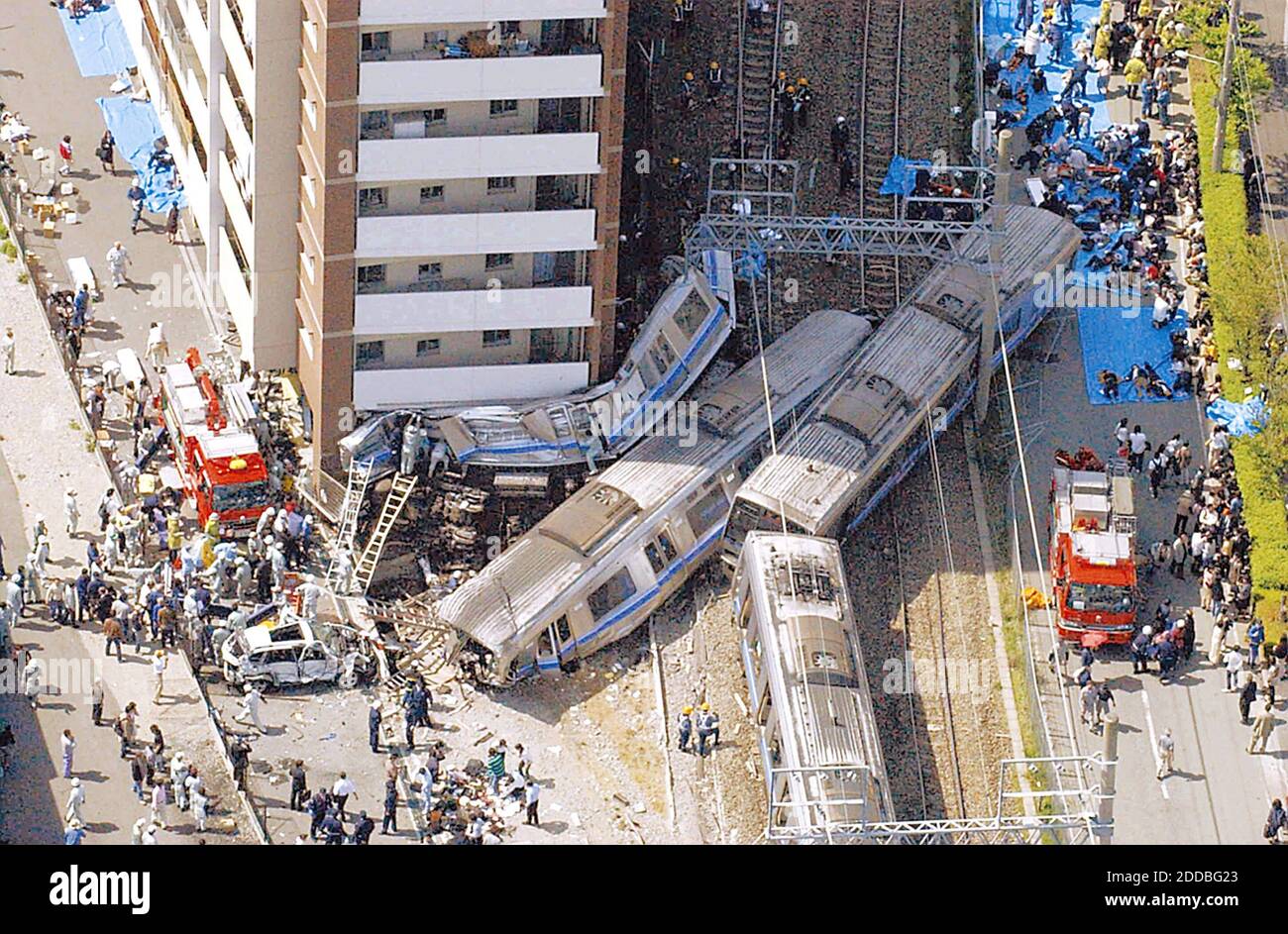 NO FILM, NO VIDEO, NO TV, NO DOCUMENTARY - A seven-car train on the JR Fukuchiyama line derailed and crashed into an apartment building Monday morning, April 25, 2005, in Amagasaki, Hyogo Prefecture, Japan. The crash killed 50 people and injured 417 in the worst railroad accident in Japan in 40 years. Photo by Yomiuri Shimbun/KRT/ABACA. Stock Photo