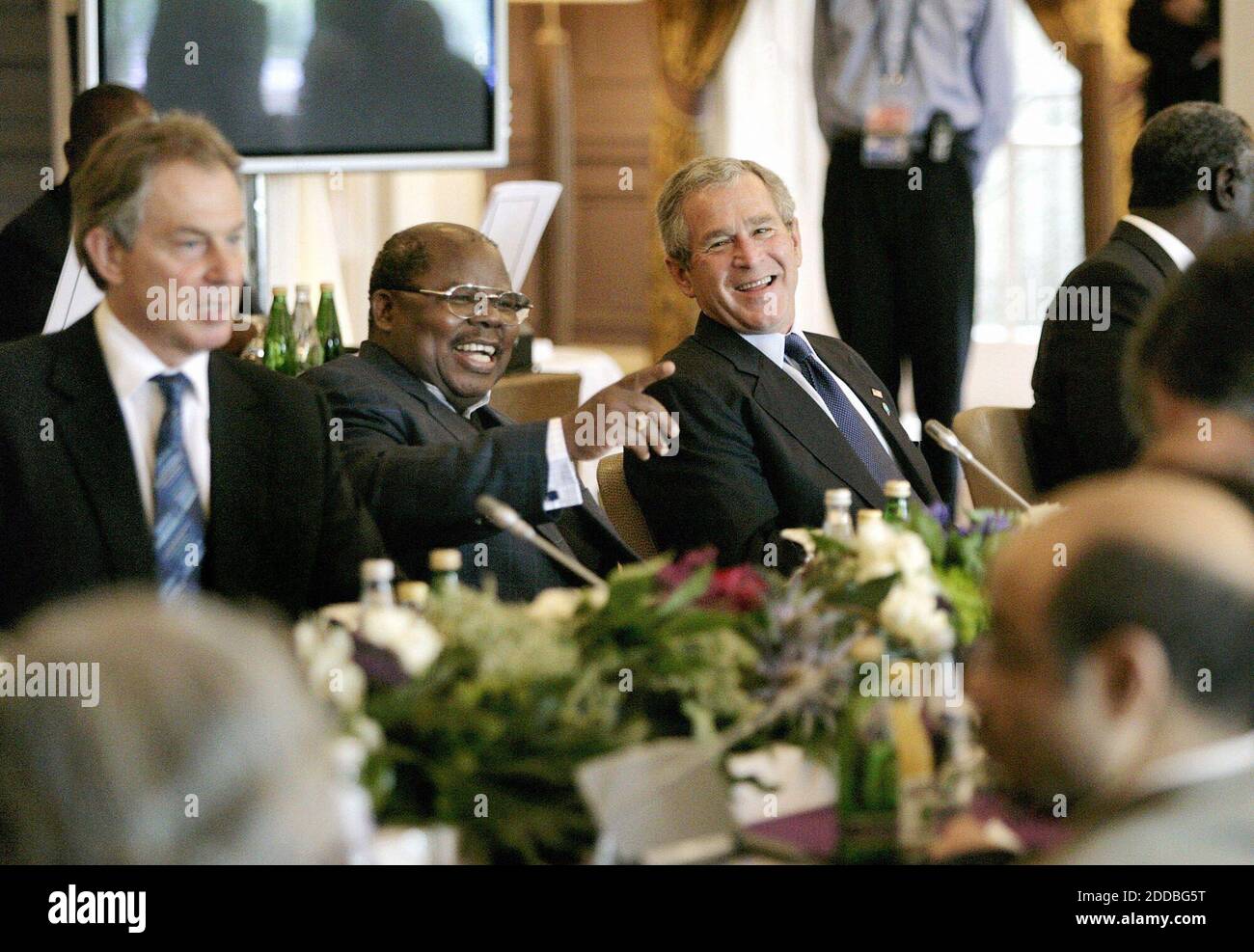 NO FILM, NO VIDEO, NO TV, NO DOCUMENTARY - U.S. President George W. Bush shares a light moment with Tanzanian President Benjamin Mkapa during the morning session of the G8 Summit at Gleneagles Hotel in Auchterarder, near Gleneagles, Scotland, UK, on Friday, July 8, 2005. Photo by Eric Draper/The White House/KRT/ABACAPRESS.COM. Stock Photo