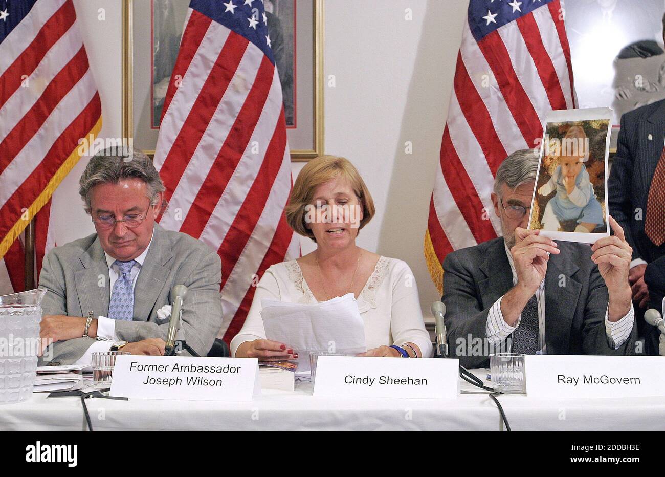 NO FILM, NO VIDEO, NO TV, NO DOCUMENTARY - Former ambassador Joseph Wilson, Cindy Sheehan, and Ray McGovern (holding a photo of Sheehan's son, Army Specialist Casey Sheehan killed in Iraq), appear during an unofficial forum on the Downing Street Minutes on Capitol Hill in Washington, DC, June 16, 2005. The document, created in 2002 for British Prime Minister Tony Blair, said that U.S. President George W. Bush was intent on invading Iraq and that intelligence was being manipulated to support Bushs interests. Photo by Chuck Kennedy/KRT/ABACAPRESS.COM Stock Photo