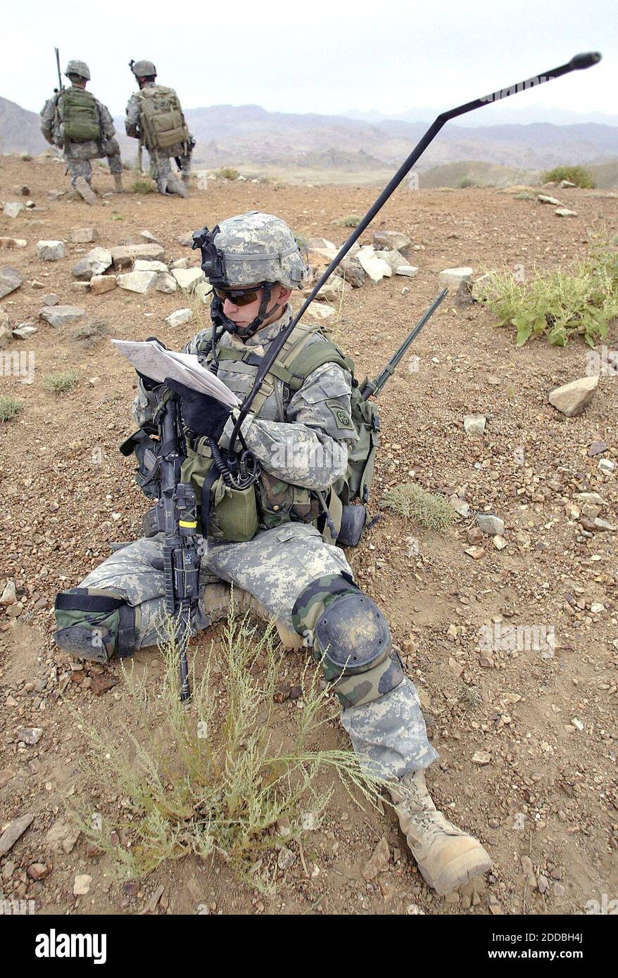 NO FILM, NO VIDEO, NO TV, NO DOCUMENTARY - Sgt. Drew Schaub, of the 82nd Airborne Division, makes radio contact with the Tactical Operations Center from the mountain top during a mission high in the mountains in Zabul Province, Afghanistan, August 8, 2005. A roadside bomb attack killed four U.S. soldiers and wounded three others in southern Afghanistan on Sunday, August 21, 2005, as Taliban insurgents pressed an escalating guerrilla war nearly four years after their radical Islamic movement was swept from power. Photo by Tom Pennington/Fort Worth Star-Telegram/KRT/ABACAPRESS.COM. Stock Photo