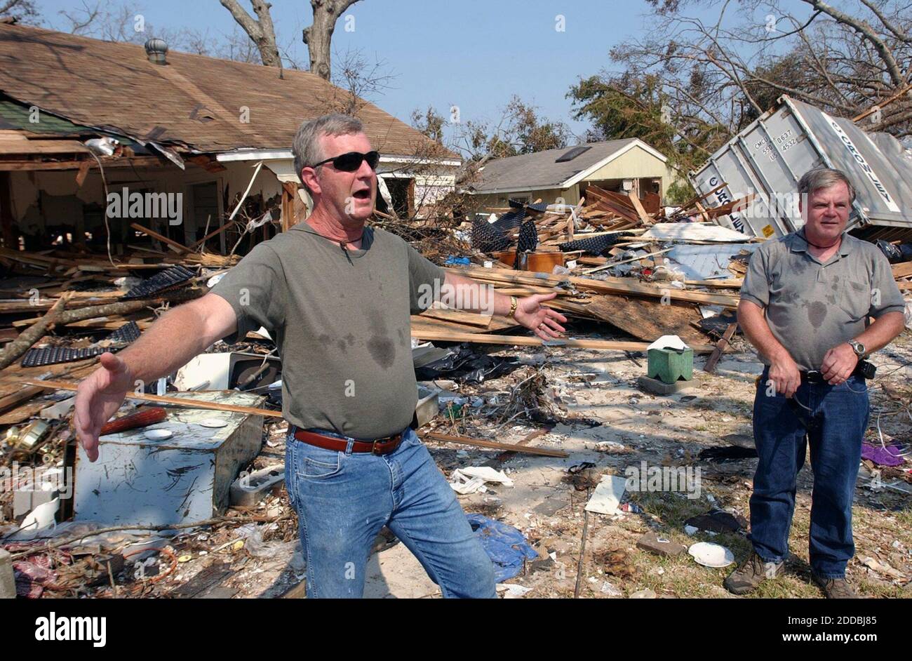 NO FILM, NO VIDEO, NO TV, NO DOCUMENTARY - Gregory R. Pearson (L) and his brother Gary Pearson look through what is left of their mother Mildred Pearson' home in Gulfport, Mississippi, on Sunday morning September 4, 2005. Photo by David Purdy/Biloxi Sun Herald/KRT/ABACAPRESS.COM Stock Photo
