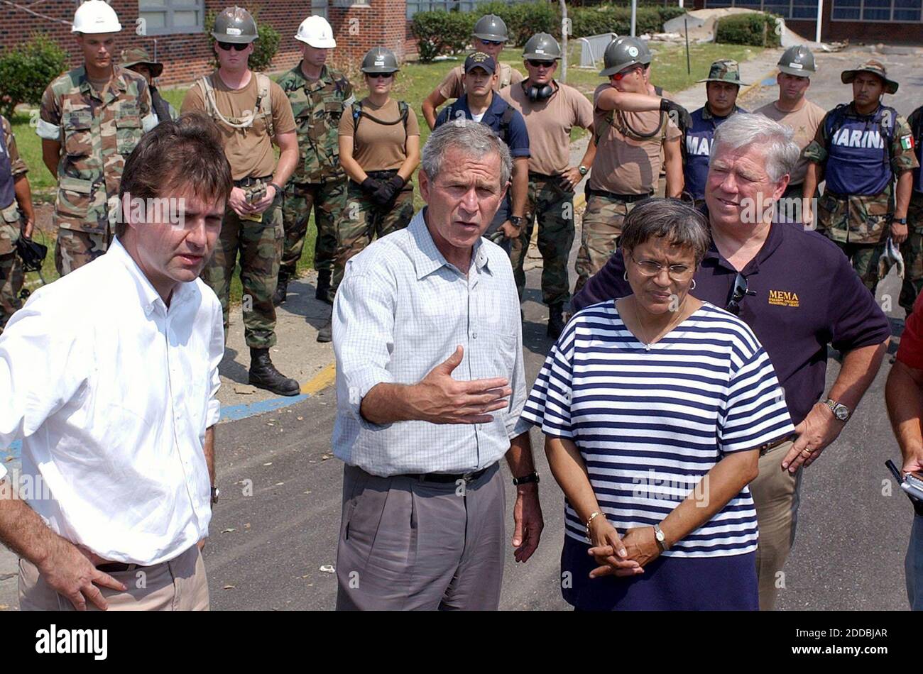 NO FILM, NO VIDEO, NO TV, NO DOCUMENTARY - President George W. Bush speaks about his tour of the Mississippi Gulf Coast on Monday, September 12, 2005 in Gulfport, Mississippi. With him are Gulfport Mayor Brent Warr, left, 28th Street Elementary School Principal Phyllis Bourn and Mississippi Gov. Haley Barbour. Photo by David Purdy/Biloxi Sun Herald/KRT/ABACA Stock Photo