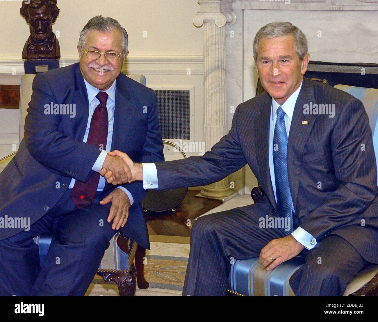 NO FILM, NO VIDEO, NO TV, NO DOCUMENTARY - Iraqi President Jalal Talabani, left, is greeted by U.S. President George W. Bush in the Oval Office of the White House, Washington, DC, USA, on September 13, 2005. Photo by George Bridges/KRT/ABACAPRESS.COM Stock Photo