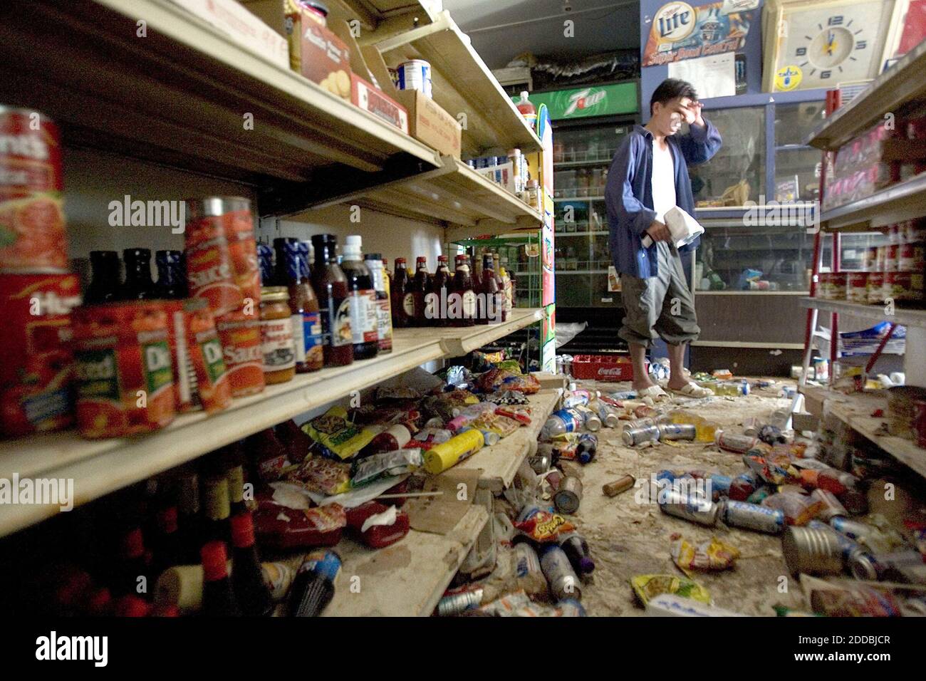 NO FILM, NO VIDEO, NO TV, NO DOCUMENTARY - Convenience store owner Hai Pham looks over the damage caused to his business by flood water and looters along St. Claude Ave in New Orleans Friday, September 16, 2005. Photo by NG Norman/Kansas City Star/KRT/ABACAPRESS.COM. Stock Photo