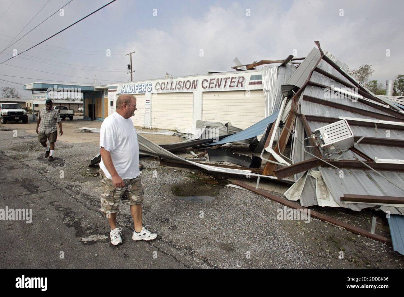 NO FILM, NO VIDEO, NO TV, NO DOCUMENTARY - Michael Sandifer gets his first look at the severe damage Hurricane Rita caused to his business, Sandifer's Collission Center, in Port Arthur, Texas, on September 25, 2005. Photo by Raul Ribieira/Miami Herald/KRT/ABACAPRESS.COM Stock Photo