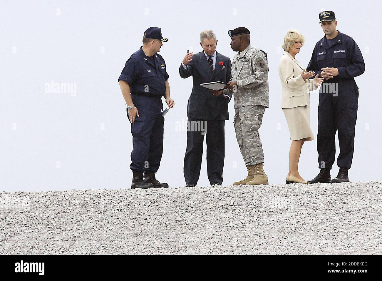 NO FILM, NO VIDEO, NO TV, NO DOCUMENTARY - Prince Charles and his wife, Camilla, Duchess of Cornwall, made a visit to the Lower 9th Ward in New Orleans, Louisiana, near the Industrial Canal levee on Friday, November 4, 2005, to see Hurricane Katrina's damage. Britain's Prince Charles talks with Coast Guard Vice Admiral Thad Allen, left, and Brig. Gen. Robert Crear, as his wife Camilla, Duchess of Cornwall, speaks with United States Coast Guard Captain Tom Atkin atop the Industrial Canal levee. Photo by Chris Oberholts/Kansas City Star/KRT/ABACAPRESS.COM Stock Photo