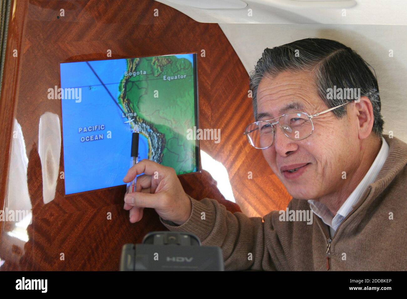 NO FILM, NO VIDEO, NO TV, NO DOCUMENTARY - Former president of Peru Alberto Fujimori is shown November 6, 2005, as he studies a map on an airplane of the border between Chile and Peru. Fujimori was arrested by Chilean authorities on his arrival. Photo by KRT/ABACAPRESS.COM Stock Photo