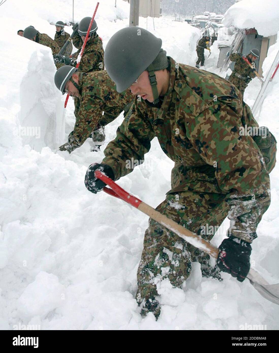 NO FILM, NO VIDEO, NO TV, NO DOCUMENTARY - Ground Self-Defense Force personnel clear snow Saturday in Iiyama, Nagano Prefecture, Japan, January 7, 2006. 71 people have died due to the snowstorms which have brought record-breaking amounts for the month of January. Photo by Yomiuri Shimbun/KRT/ABACAPRESS.COM Stock Photo