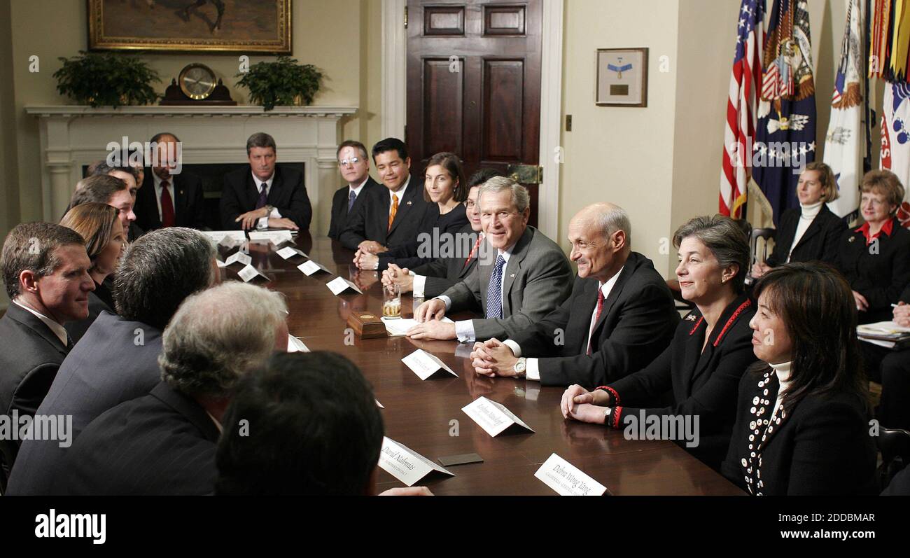 NO FILM, NO VIDEO, NO TV, NO DOCUMENTARY - President George W. Bush, flanked by Attorney General Alberto Gonzales, center left, and Secretary of Homeland Security Michael Chertoff, center right, participates, Tuesday, January 3, 2006, in a meeting with U.S. Attorneys from around the country on the Patriot Act in the Roosevelt Room in the White House. Photo by Chuck Kennedy/KRT/ABACAPRESS.COM Stock Photo
