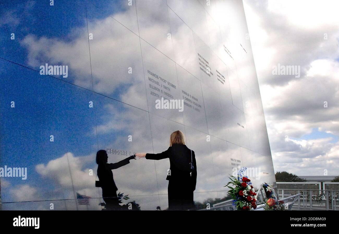 NO FILM, NO VIDEO, NO TV, NO DOCUMENTARY - Faith Freeman Johnson, daughter of NASA astronaut Theodore C. Freeman, touches his name engraved in granite at the Space Mirror Memorial at Kennedy Space Center Visitor Complex, Florida, Saturday, January 28, 2006. Astronauts Memorial Foundation conducted a ceremony to honor the crew of Challenger STS 51L and all astronauts who have sacrificed their lives on the 20th anniversary of the Challenger accident. Photo by Red Huber/Orlando Sentinel/KRT/ABACAPRESS.COM Stock Photo