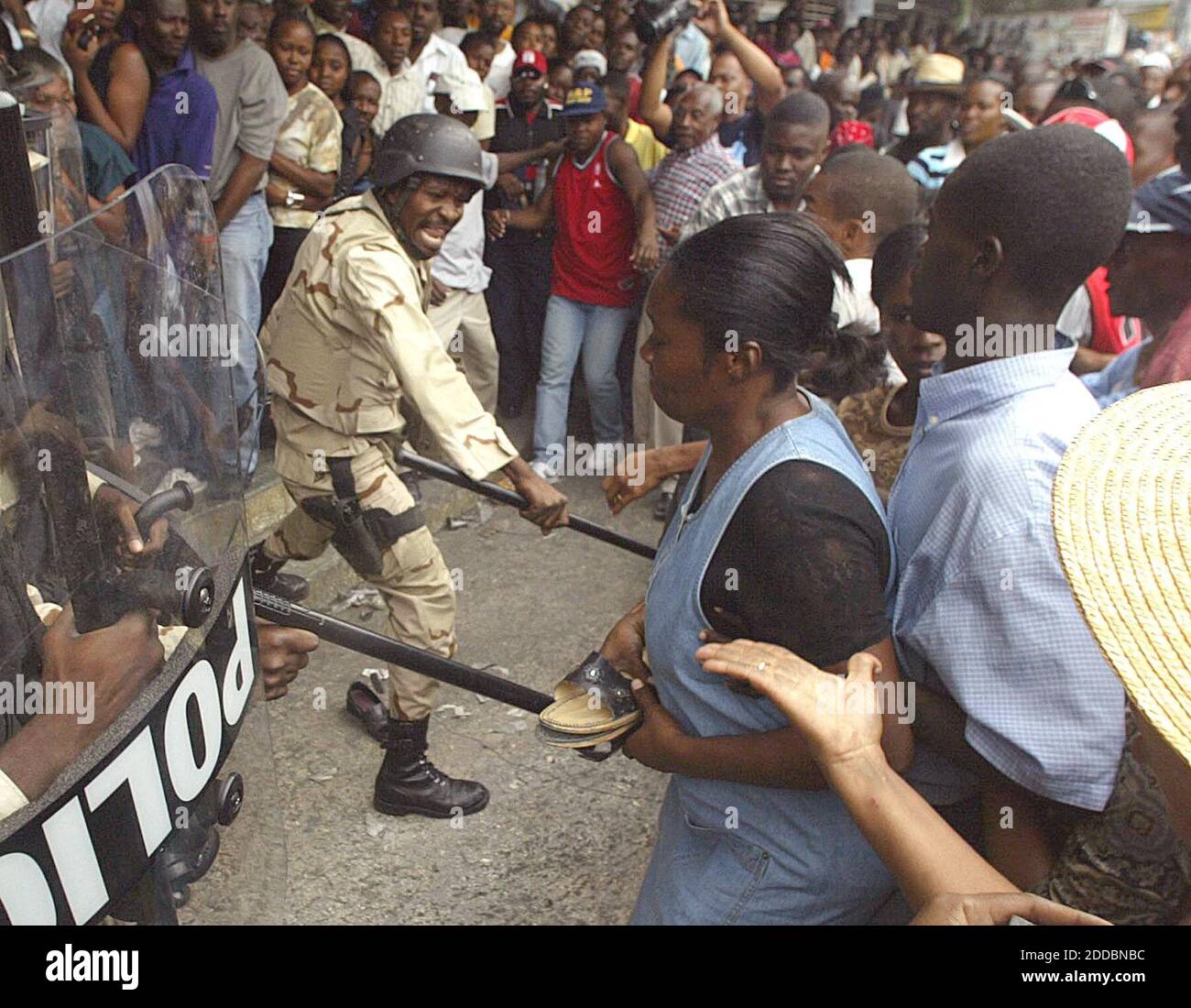 NO FILM, NO VIDEO, NO TV, NO DOCUMENTARY - A Haitian police officer fends off voters in front of the doors of the Lycee de Petion-ville, in Haiti, Tuesday, February 7, 2006. Photo by C.W. Griffin/Miami Herald/KRT/ABACAPRESS.COM Stock Photo