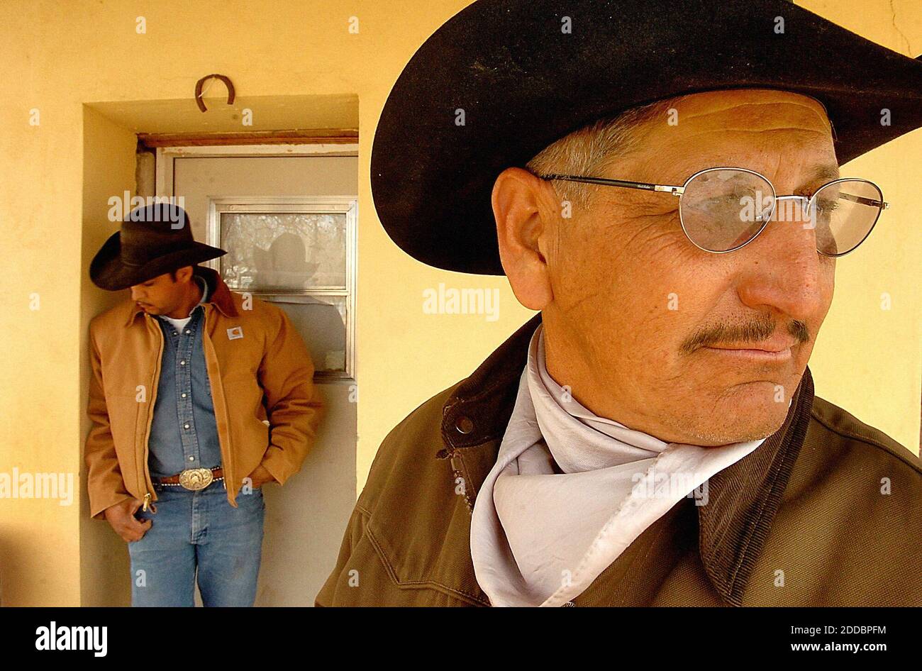 NO FILM, NO VIDEO, NO TV, NO DOCUMENTARY - Rancher Plutarco Eli'as (right) tends 600 acres in Arivaca, Arizona. He says he frequently see migrants passing through. 'They're not stopping it, they just divert them around,' he says. Jesu's Morgan (left) also works the ranch. Photo by Patrick Schneider/Charlotte Observer/KRT/ABACAPRESS.COM Stock Photo