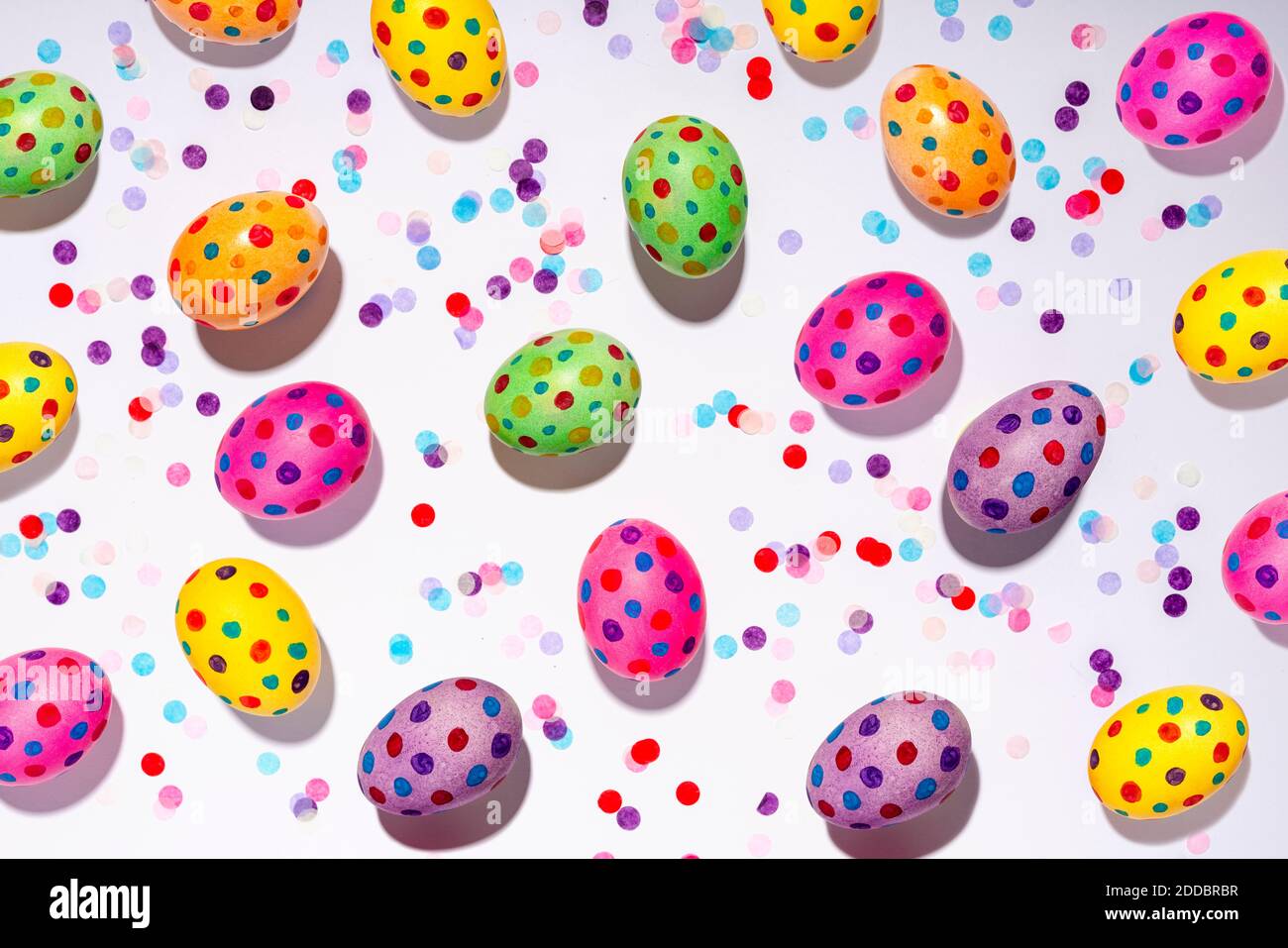 Confetti and colorful spotted Easter eggs Stock Photo Alamy